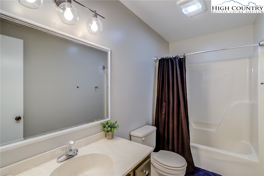 523 Pine Ridge Road Beech Mountain, NC 28604 - Photo 23 of 42 a bathroom with a sink toilet and shower