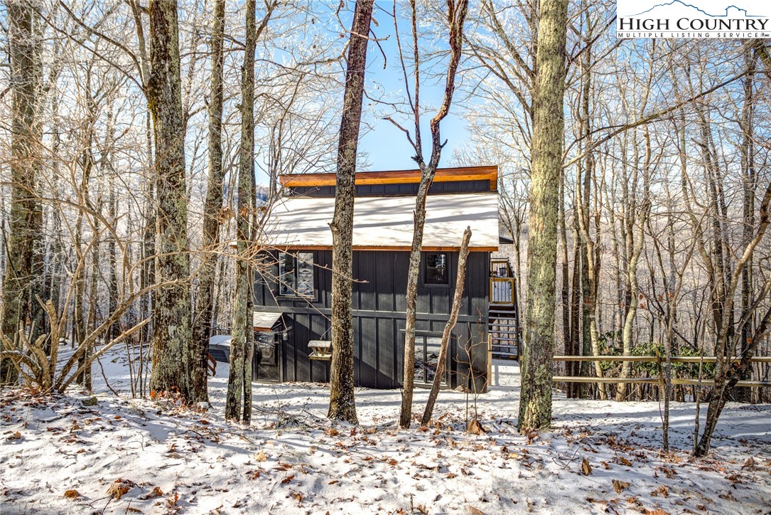 523 Pine Ridge Road Beech Mountain, NC 28604 - Photo 31 of 42 a house with trees in front of it