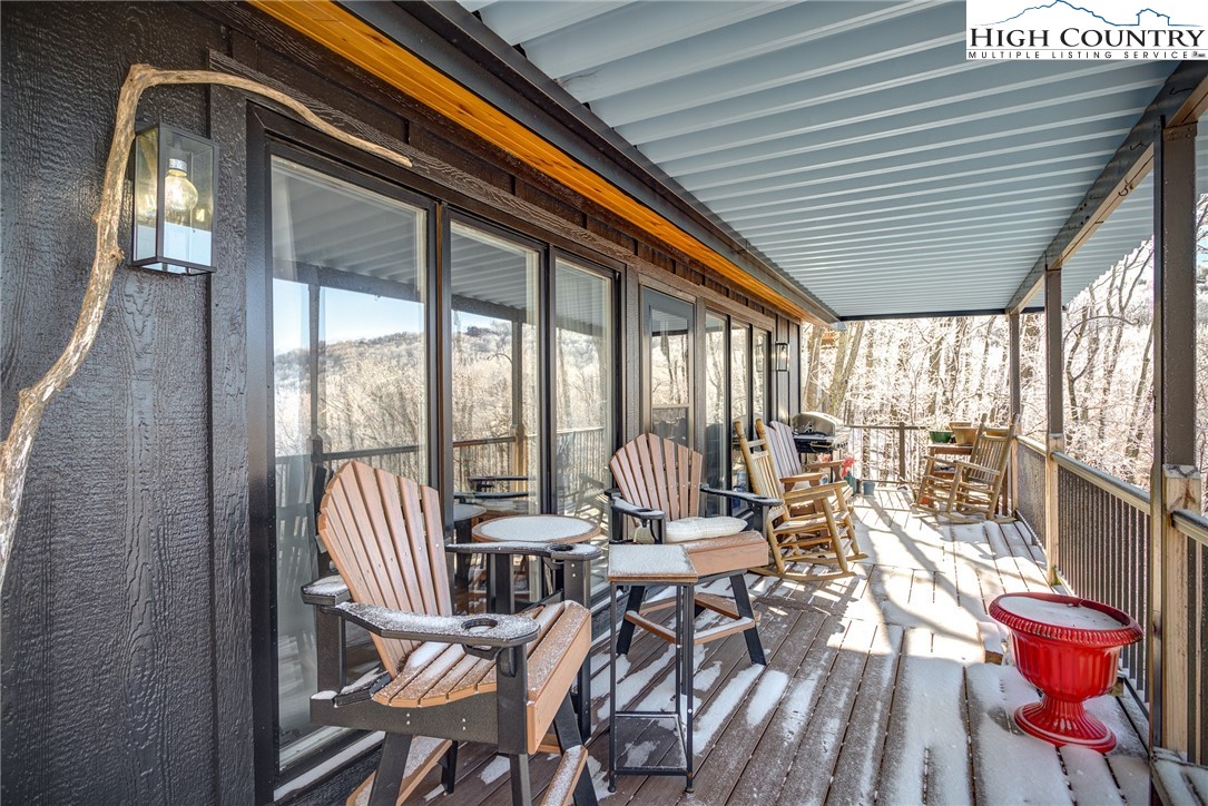 523 Pine Ridge Road Beech Mountain, NC 28604 - Photo 34 of 42 a living room with furniture and a large window