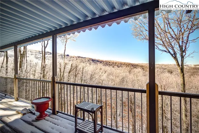 a view of balcony with wooden floor and outdoor seating
