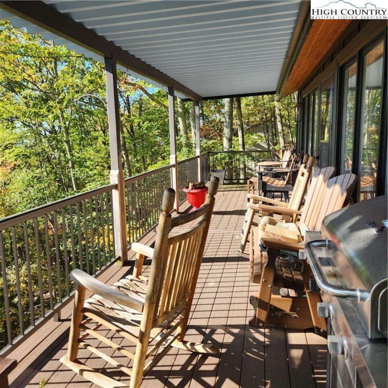 523 Pine Ridge Road Beech Mountain, NC 28604 - Photo 41 of 42 a view of balcony with wooden floor and outdoor seating