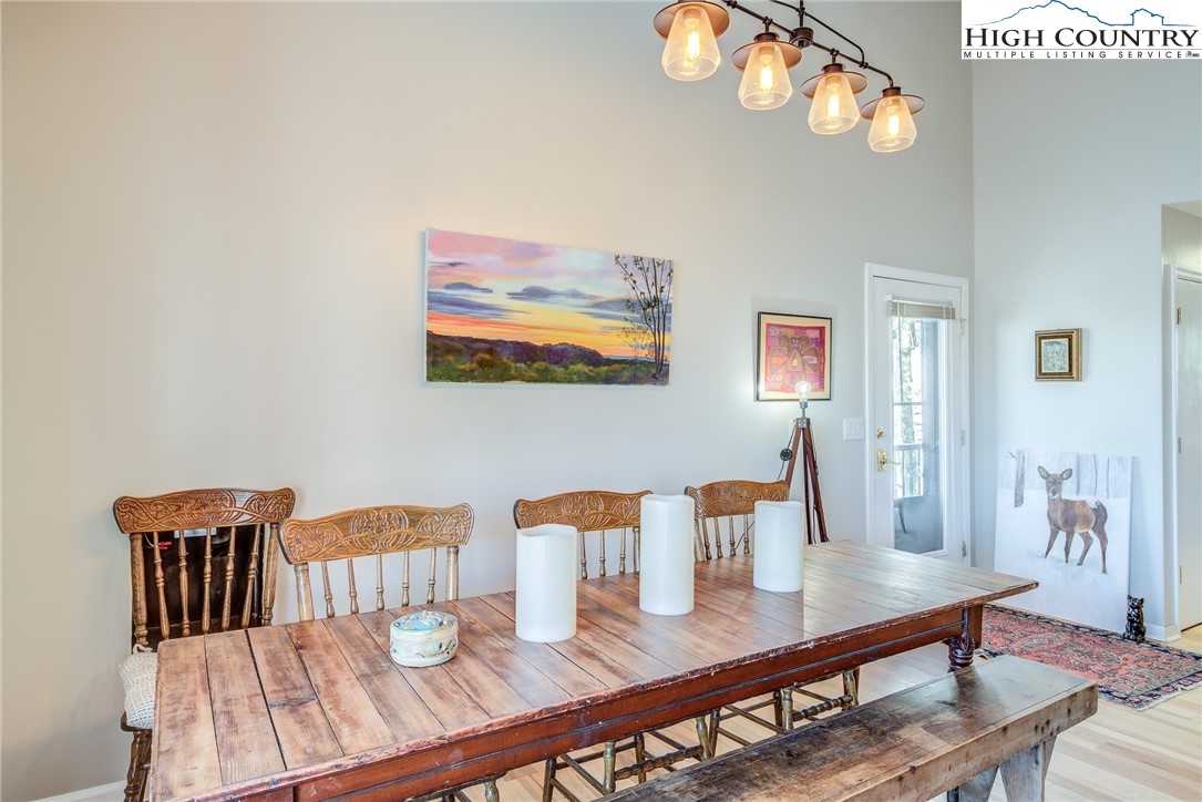 523 Pine Ridge Road Beech Mountain, NC 28604 - Photo 9 of 42 a view of a dining room with furniture
