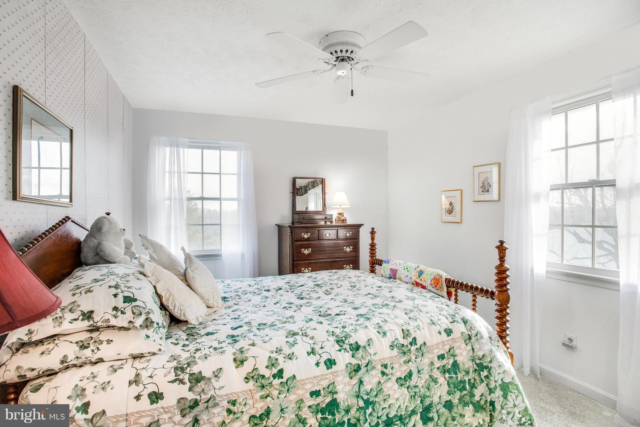 19003 Graystone Road White Hall, MD 21161 - Photo 12 of 21 a bedroom with a large bed and a window