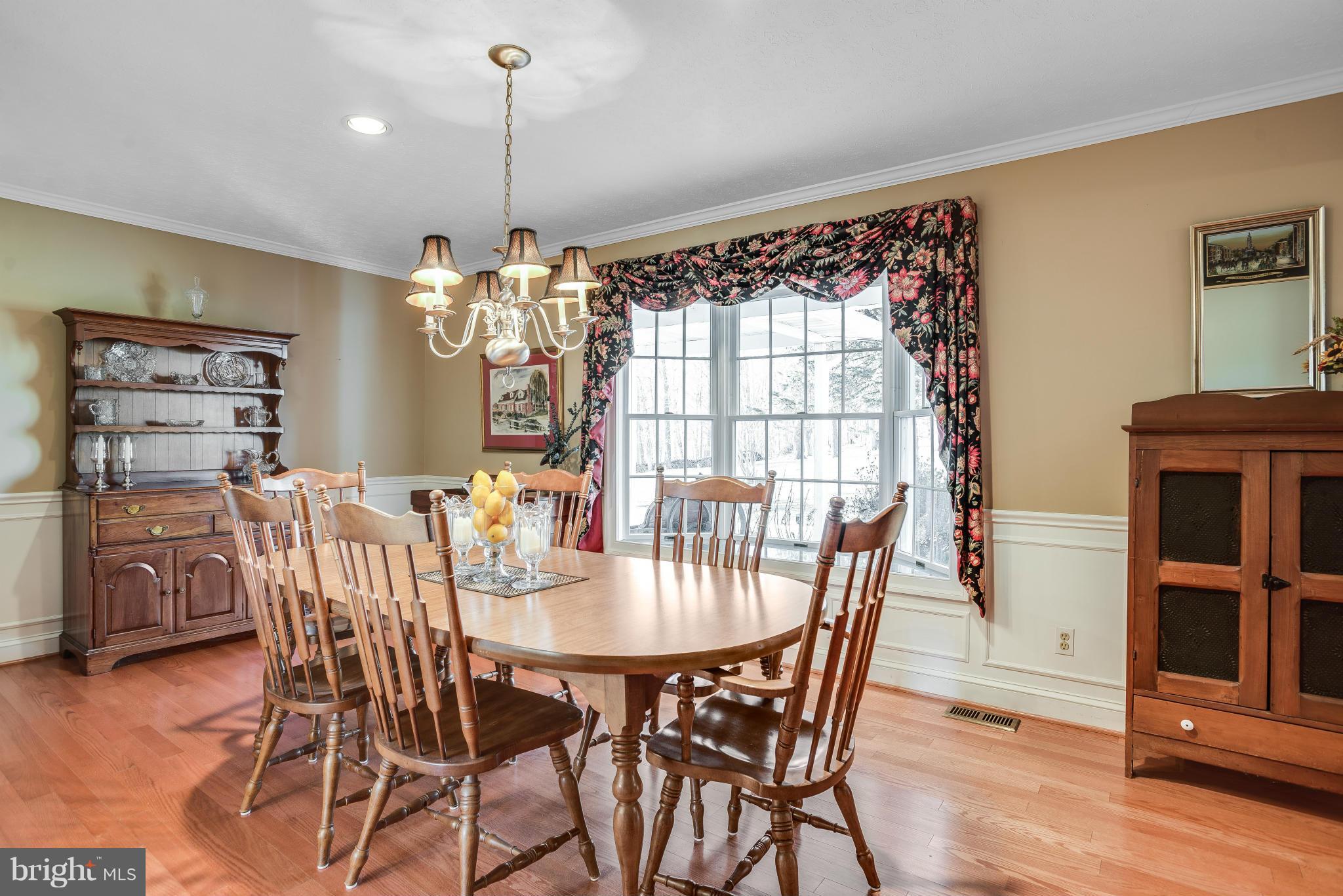 19003 Graystone Road White Hall, MD 21161 - Photo 4 of 21 a view of a dining room with furniture window and wooden floor