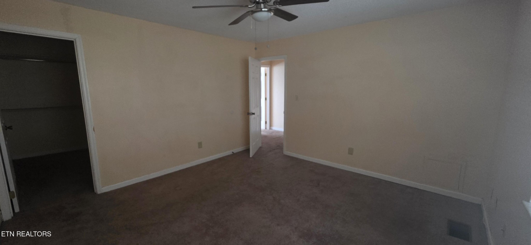 113 High Point Lane Oak Ridge, TN 37830 - Photo 16 of 24 an empty room with a ceiling fan and carpet