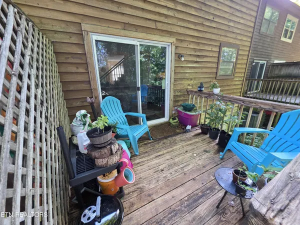 a sitting area with furniture and wooden floor