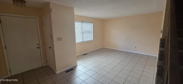 a view of an empty room with window