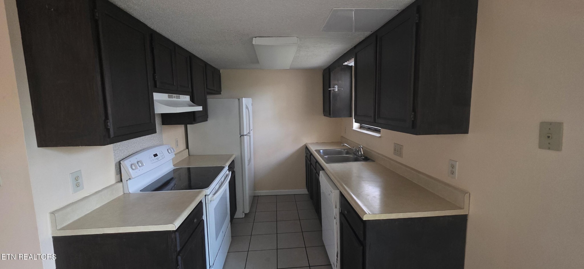 113 High Point Lane Oak Ridge, TN 37830 - Photo 6 of 24 a kitchen with stainless steel appliances granite countertop a sink stove and microwave