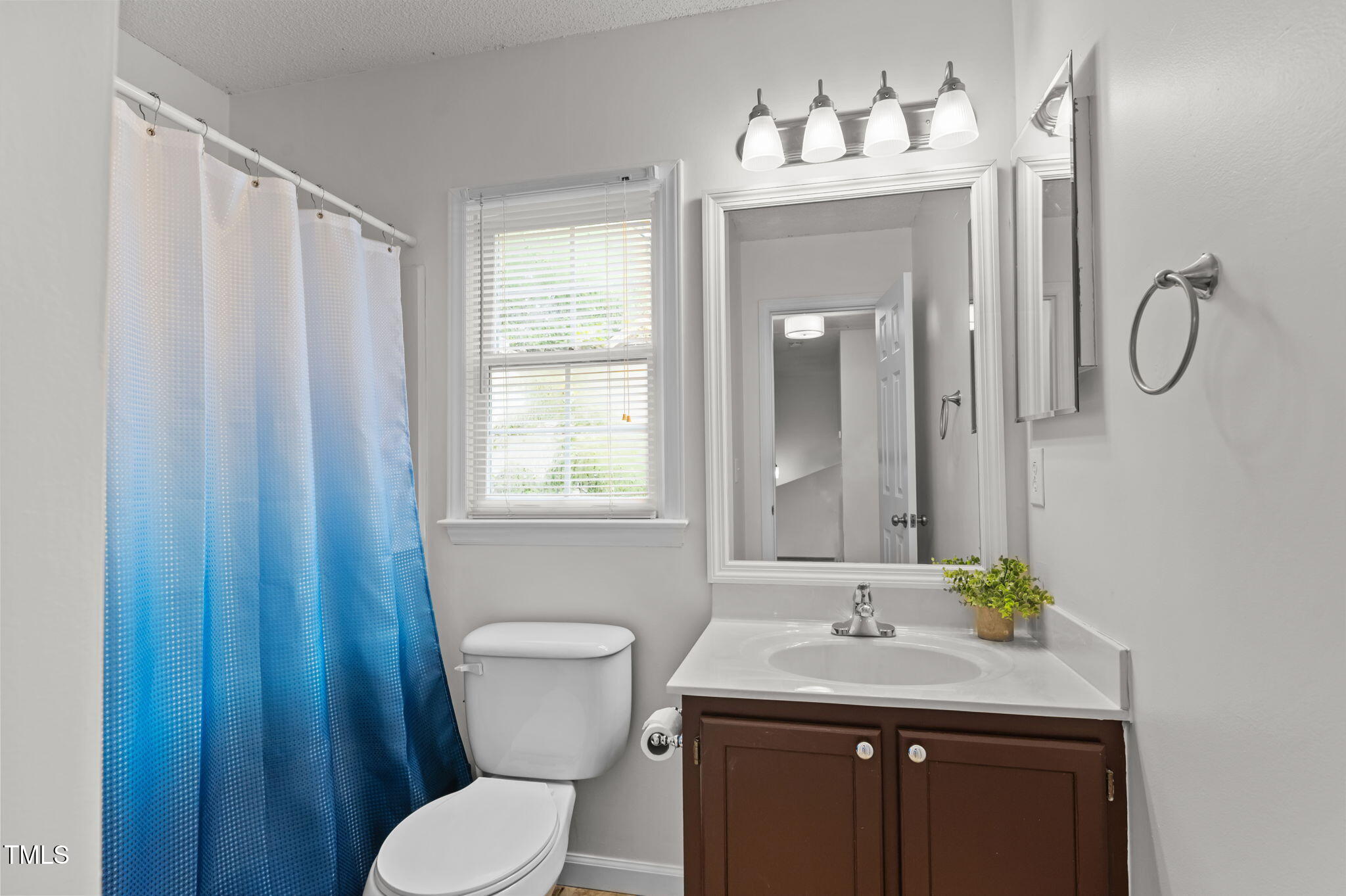 12005 North Exeter Way Raleigh, NC 27613 - Photo 24 of 38 Hall Bathroom