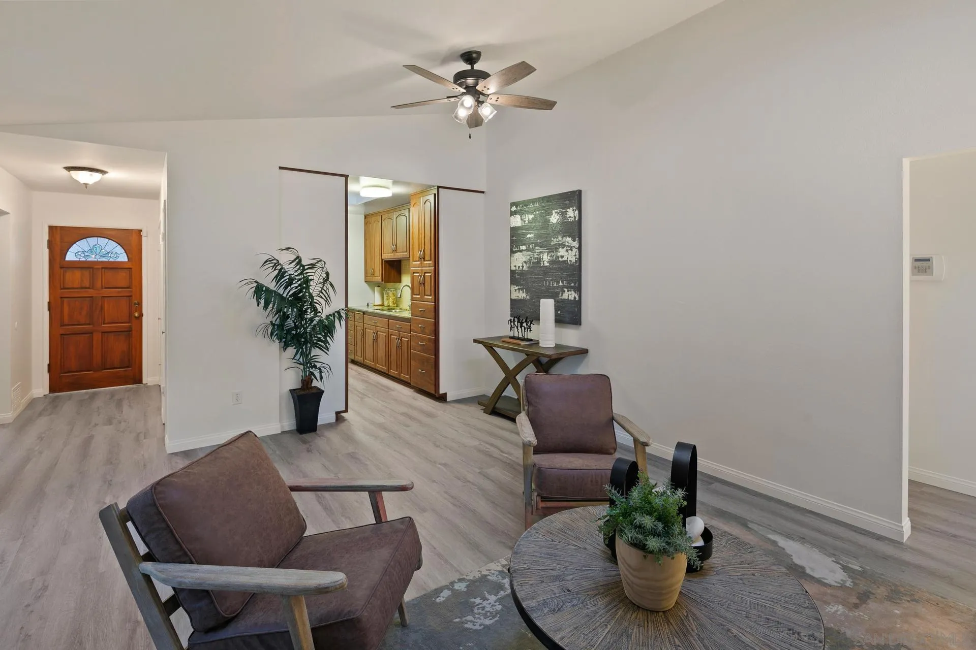 916 Crest Drive Encinitas, CA 92024 - Photo 13 of 47 a living room with furniture potted plant and a chandelier