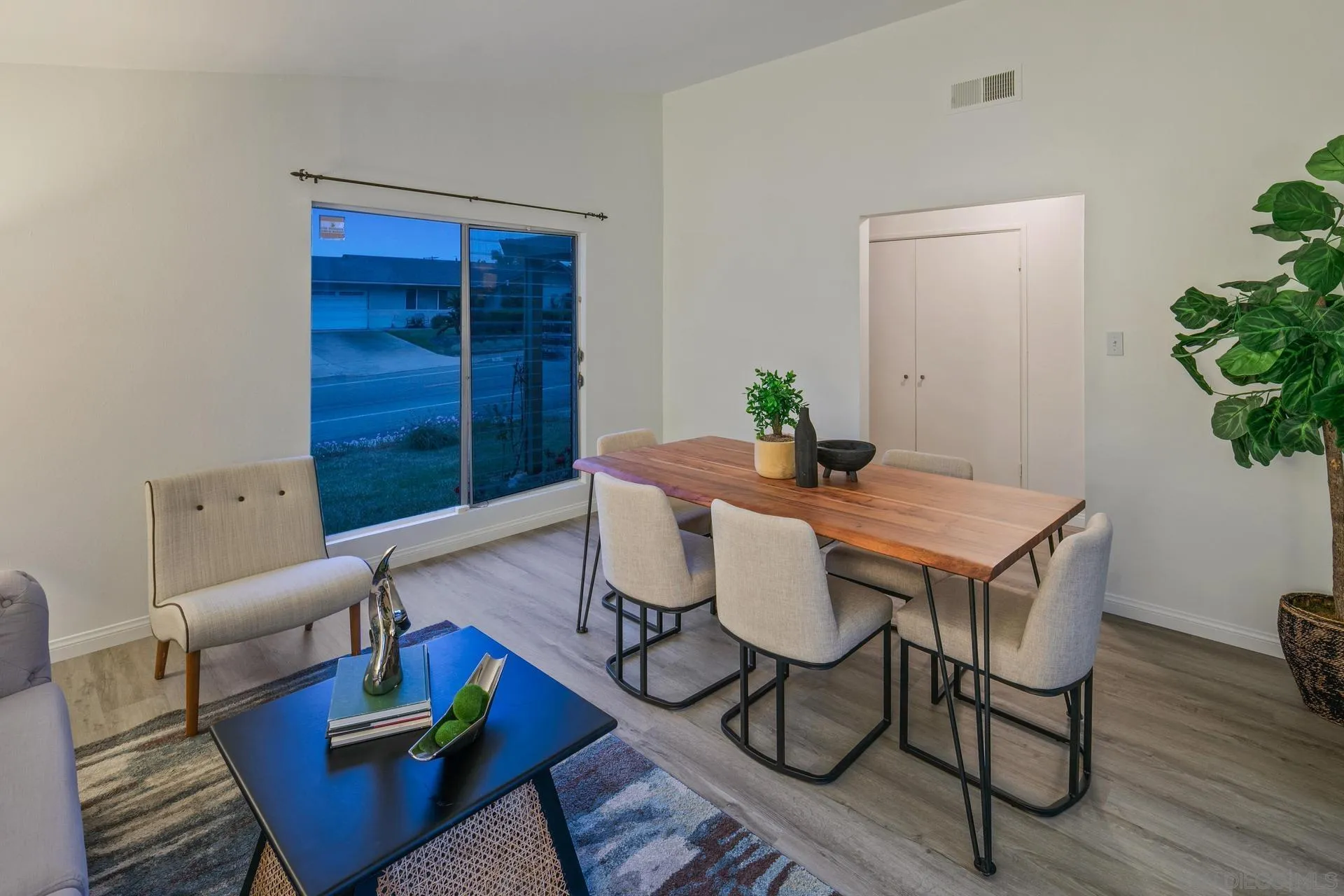 916 Crest Drive Encinitas, CA 92024 - Photo 20 of 47 a view of a dining room with furniture window and wooden floor