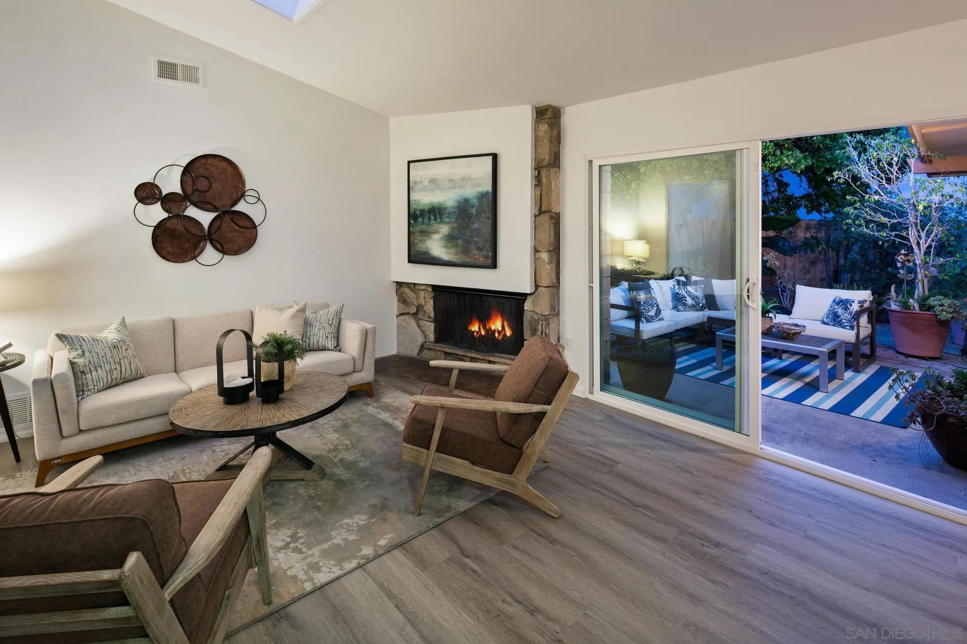916 Crest Drive Encinitas, CA 92024 - Photo 26 of 47 a living room with furniture and a fireplace