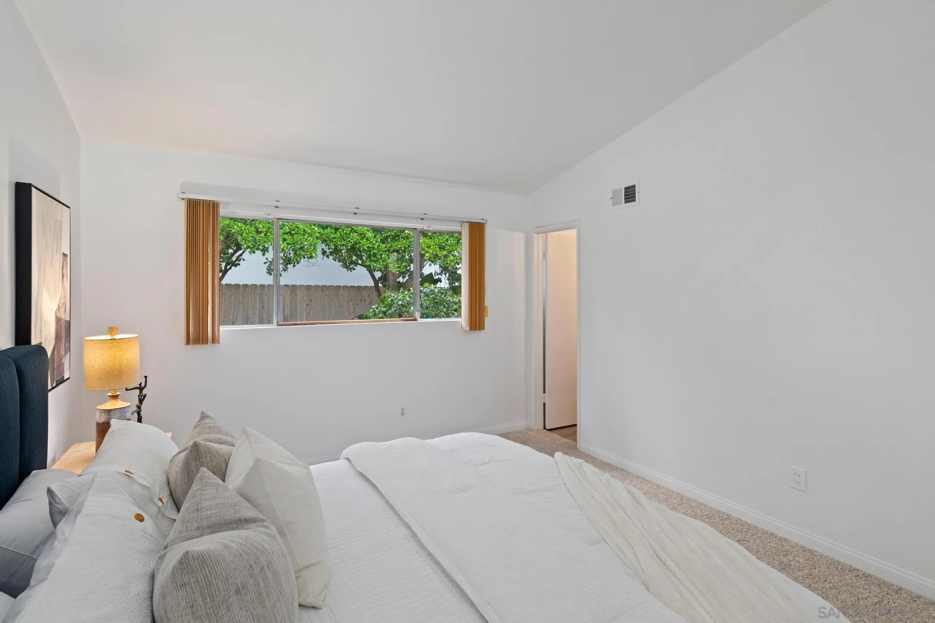 916 Crest Drive Encinitas, CA 92024 - Photo 29 of 47 a bedroom with a bed and a window