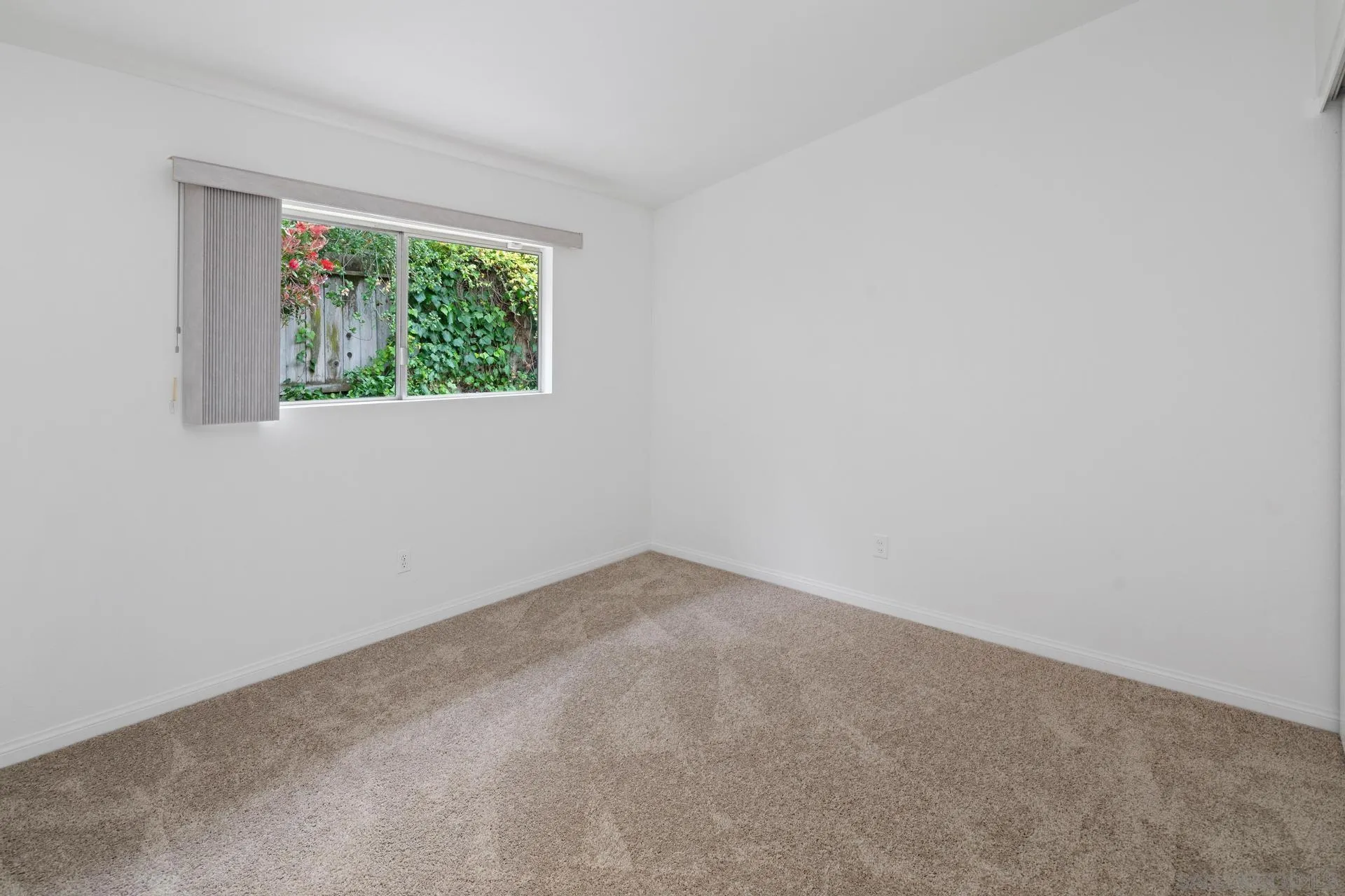 916 Crest Drive Encinitas, CA 92024 - Photo 32 of 47 an empty room with a window