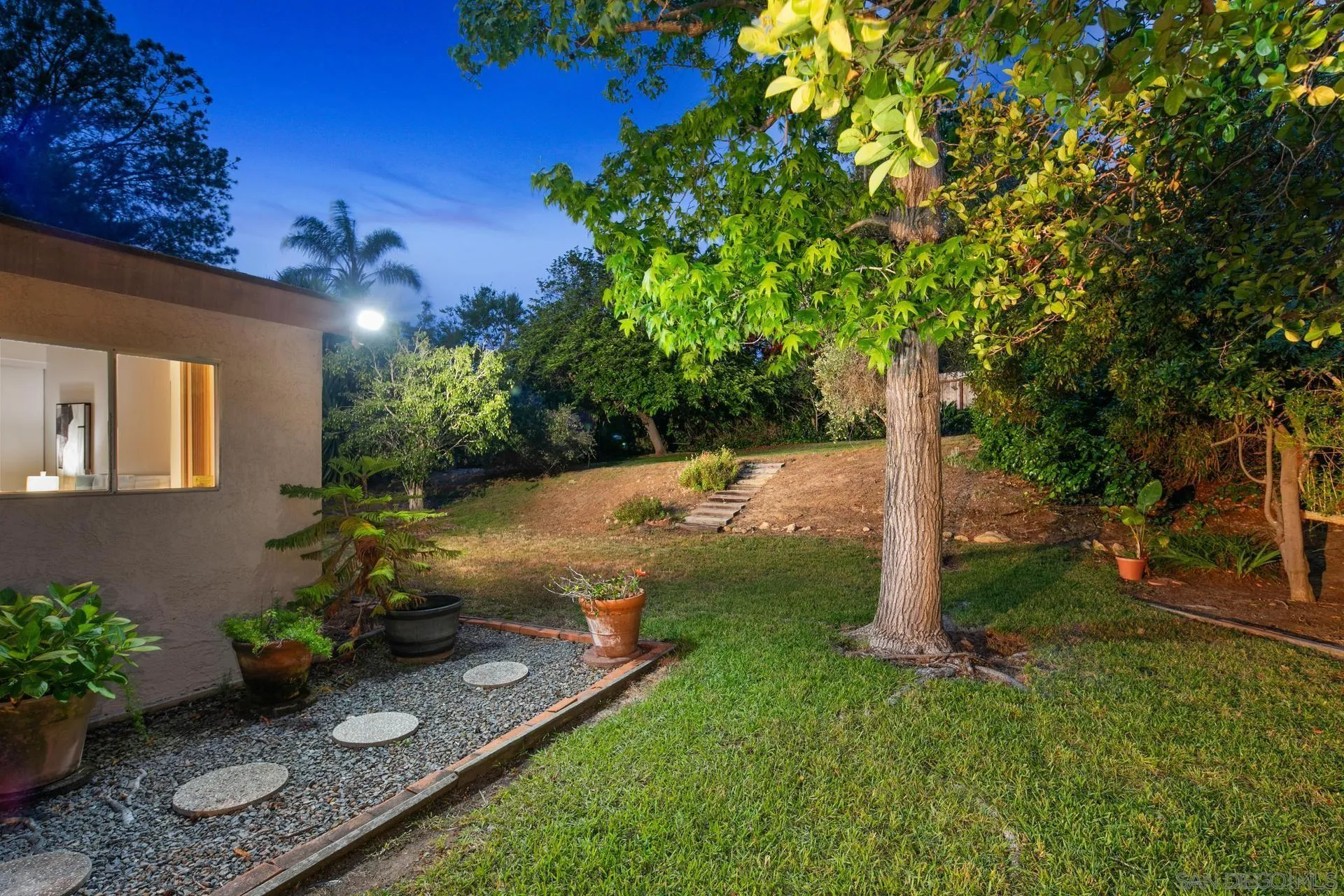 916 Crest Drive Encinitas, CA 92024 - Photo 6 of 47 a view of a backyard with potted plants