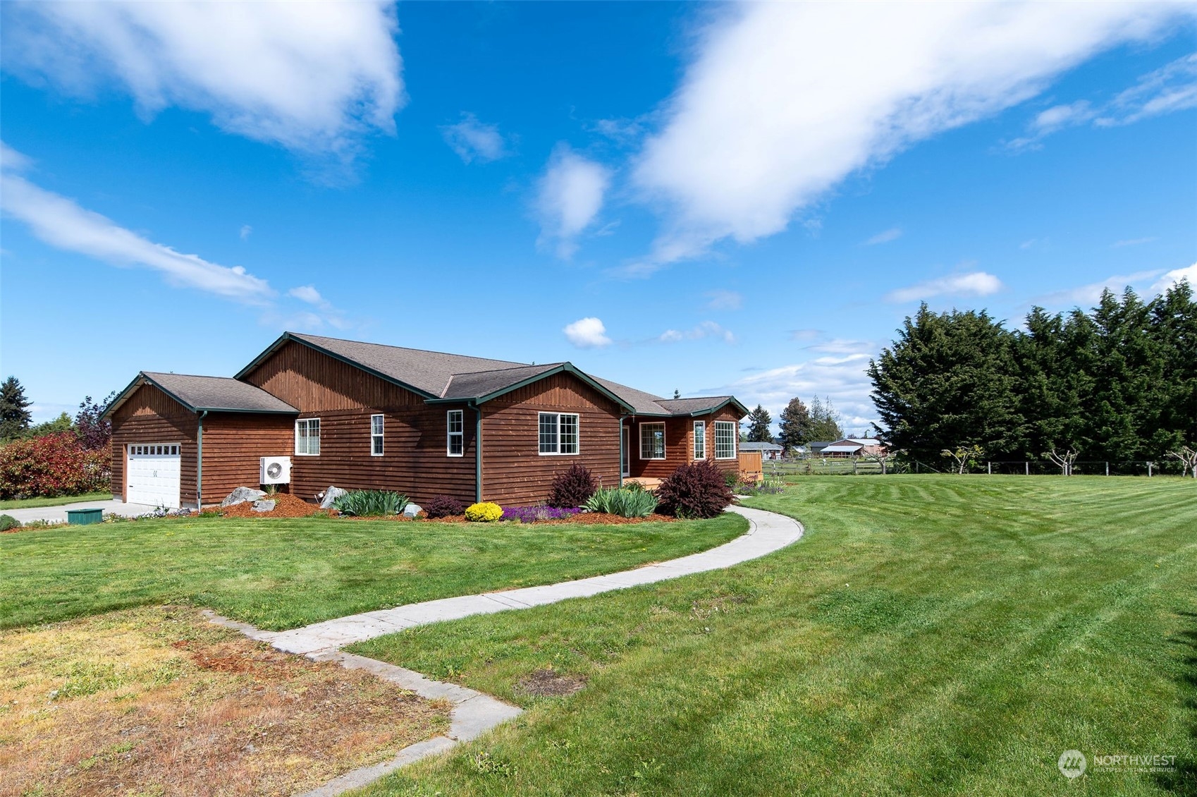 600 North Priest Road Sequim, WA 98382 - Photo 1 of 40 a front view of a house with a yard