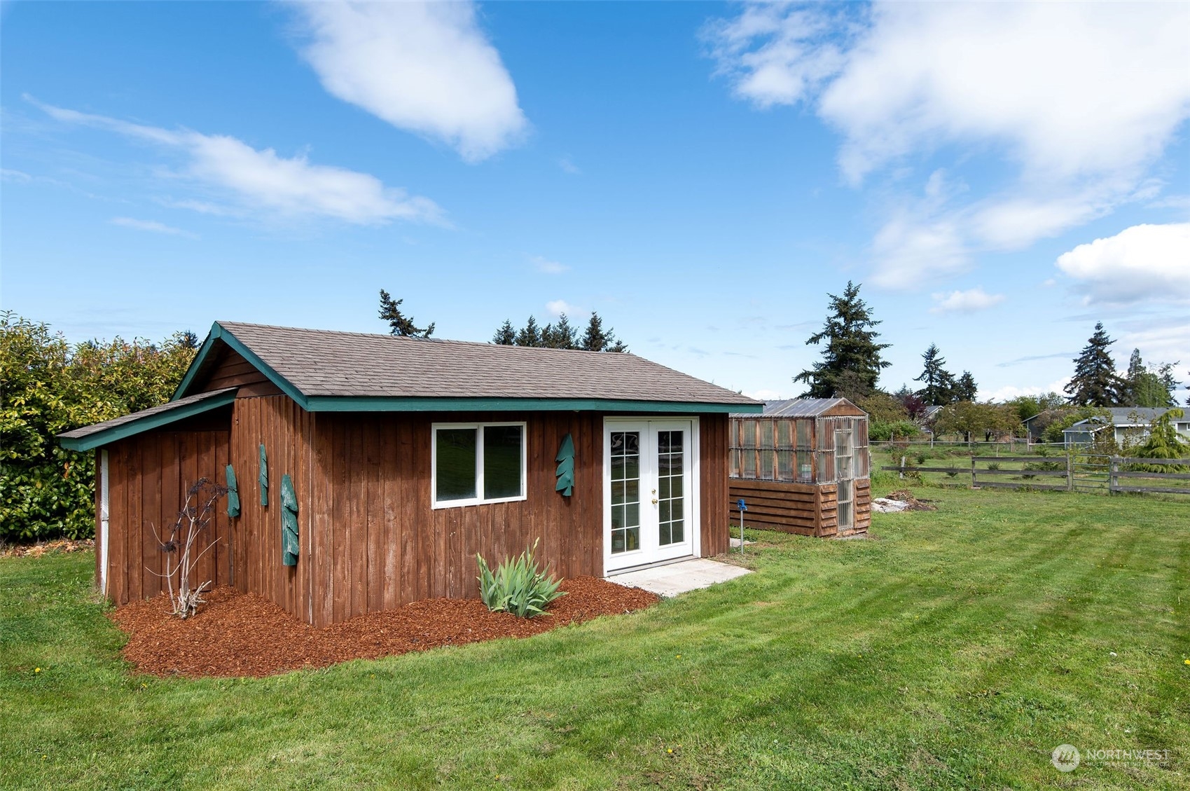 600 North Priest Road Sequim, WA 98382 - Photo 10 of 40 a front view of a house with a garden