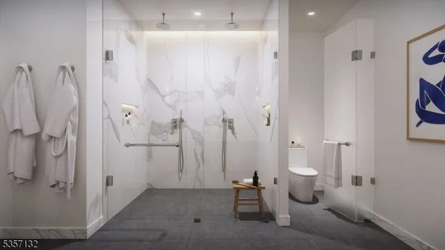 a view of a bathroom with shower and toilet