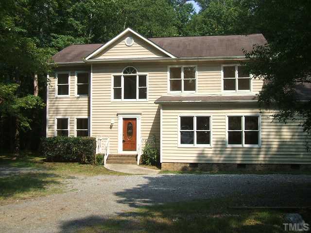 4217 Pope Road Durham, NC 27707 - Photo 1 of 10 a front view of a house with a yard