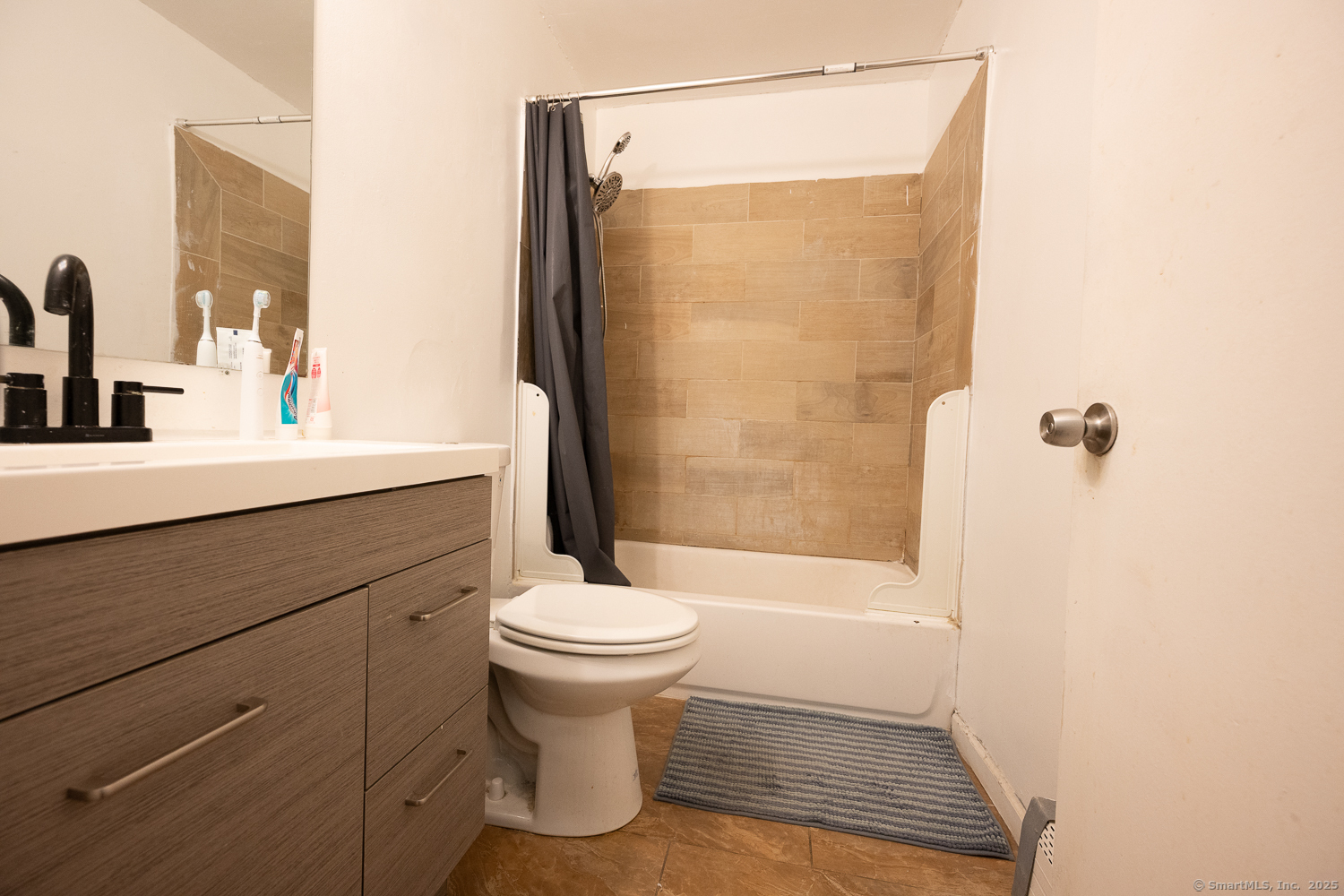 346 Forbes Avenue, Unit 346 New Haven, CT 06512 - Photo 11 of 15 a bathroom with a sink a toilet and shower