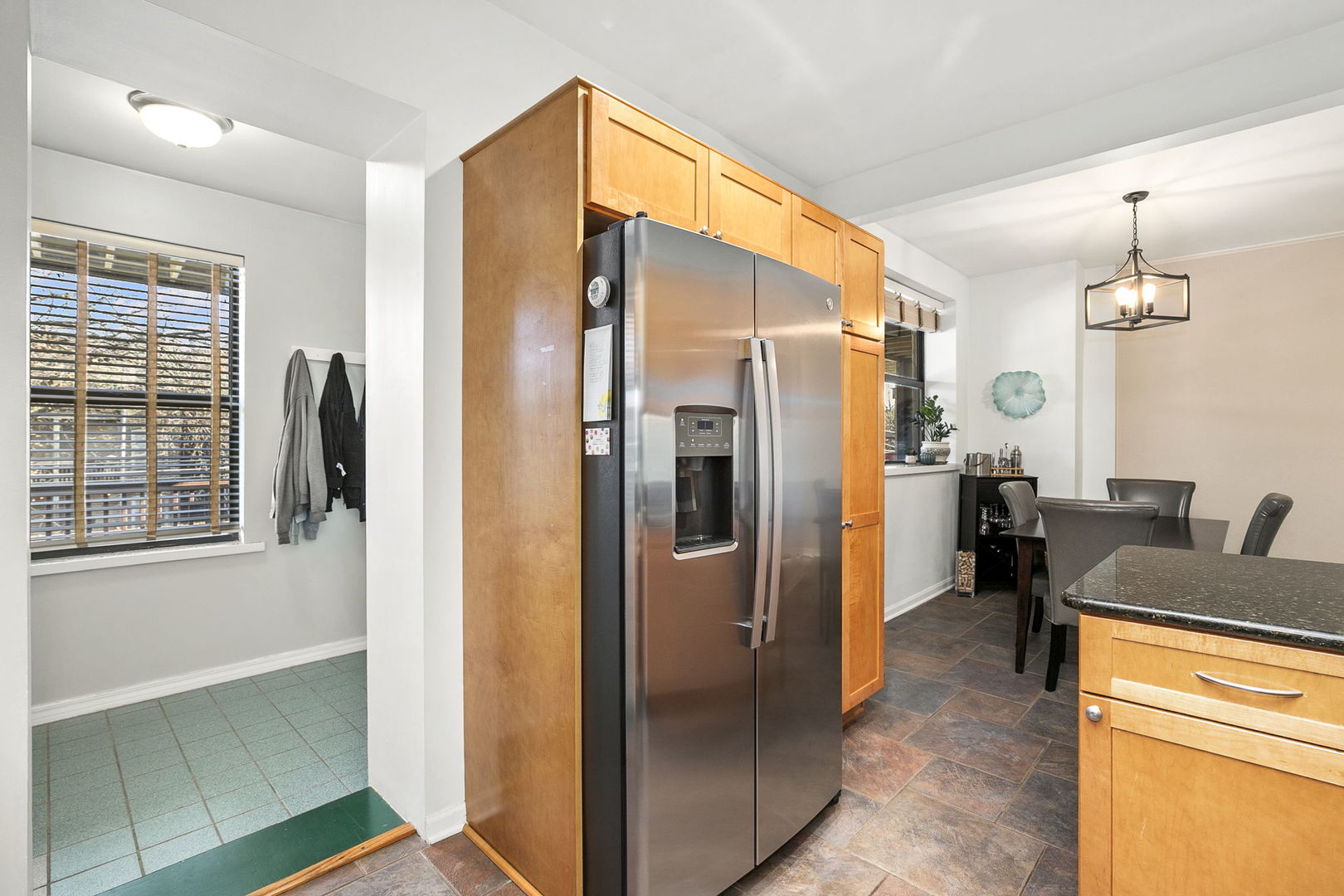 4429 North Beacon Street, Unit 2N Chicago, IL 60640 - Photo 13 of 32 a kitchen with stainless steel appliances granite countertop a refrigerator and a sink