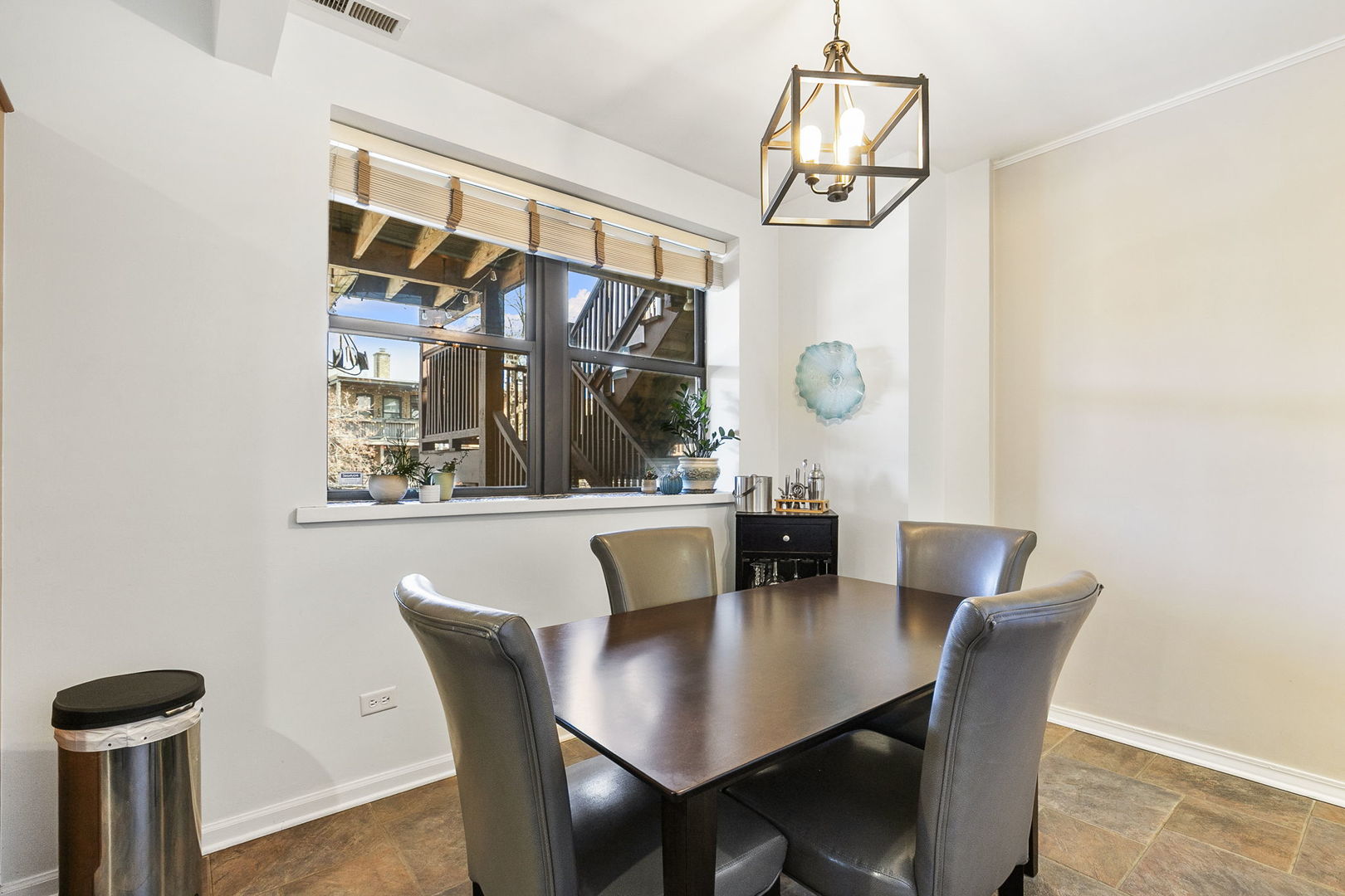 4429 North Beacon Street, Unit 2N Chicago, IL 60640 - Photo 16 of 32 a view of a dining room with furniture and wooden floor