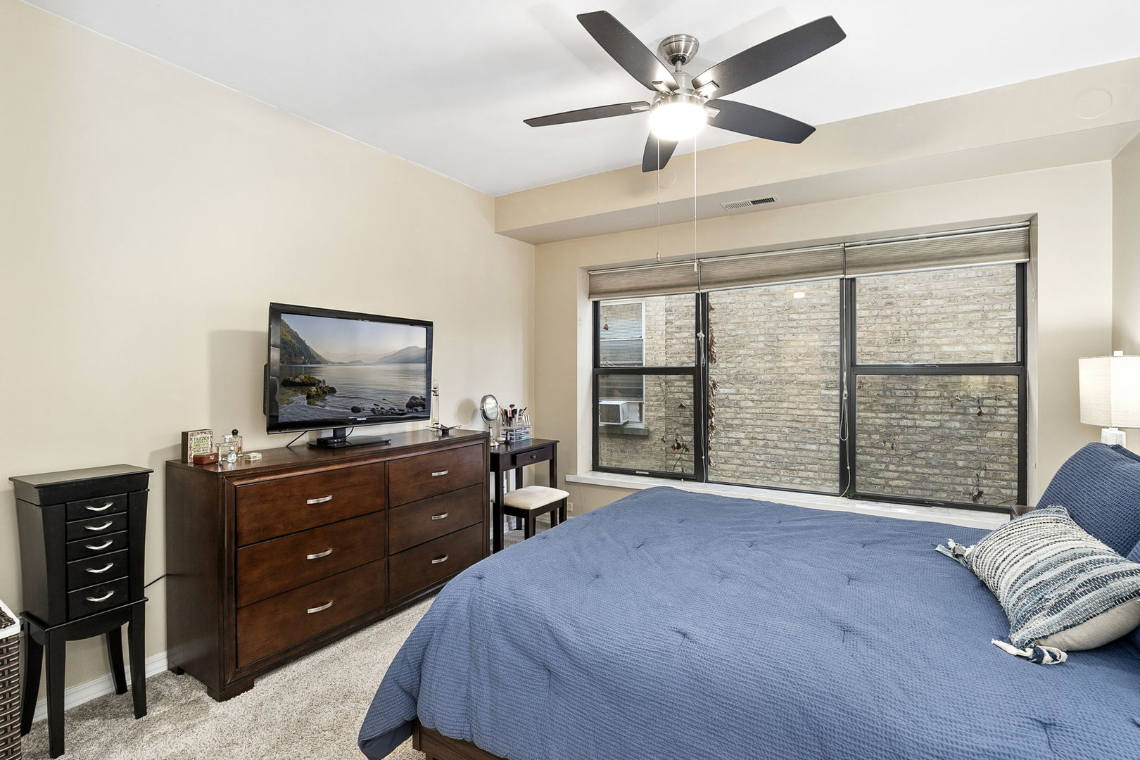 4429 North Beacon Street, Unit 2N Chicago, IL 60640 - Photo 19 of 32 a bedroom with a bed and a flat screen tv