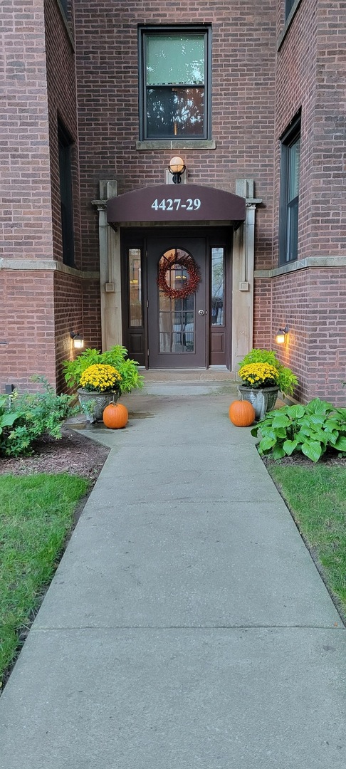 4429 North Beacon Street, Unit 2N Chicago, IL 60640 - Photo 2 of 32 a front view of a house with garden