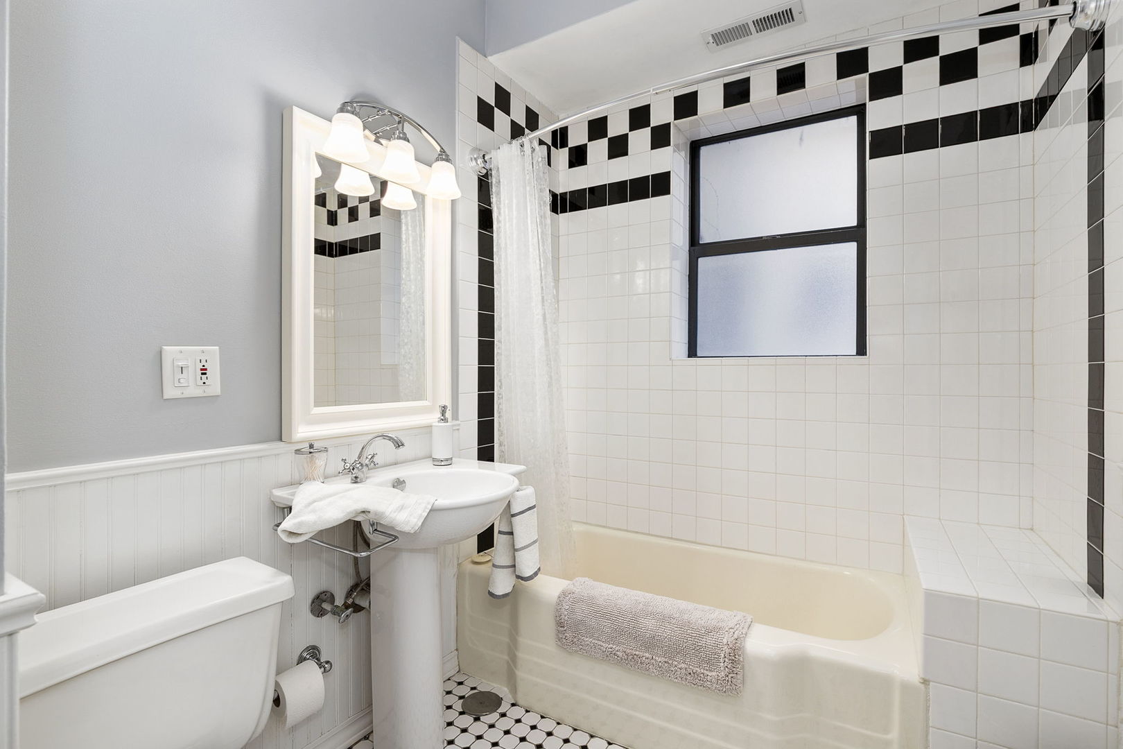 4429 North Beacon Street, Unit 2N Chicago, IL 60640 - Photo 26 of 32 a bathroom with a sink toilet and shower