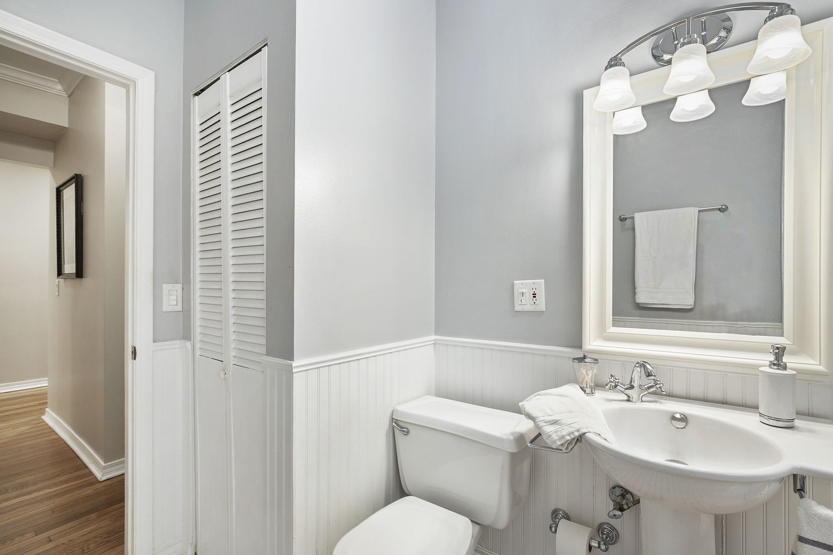 4429 North Beacon Street, Unit 2N Chicago, IL 60640 - Photo 27 of 32 a bathroom with a sink and mirror with toilet