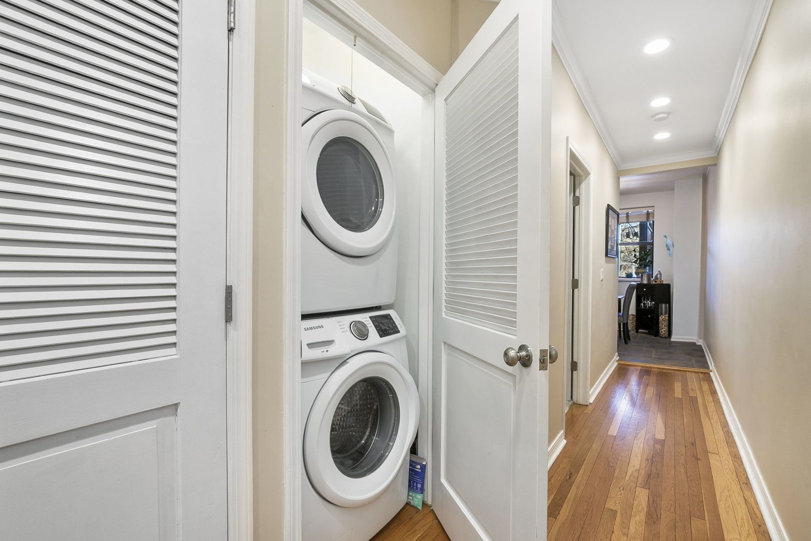 4429 North Beacon Street, Unit 2N Chicago, IL 60640 - Photo 28 of 32 a view of a hallway with washer and dryer