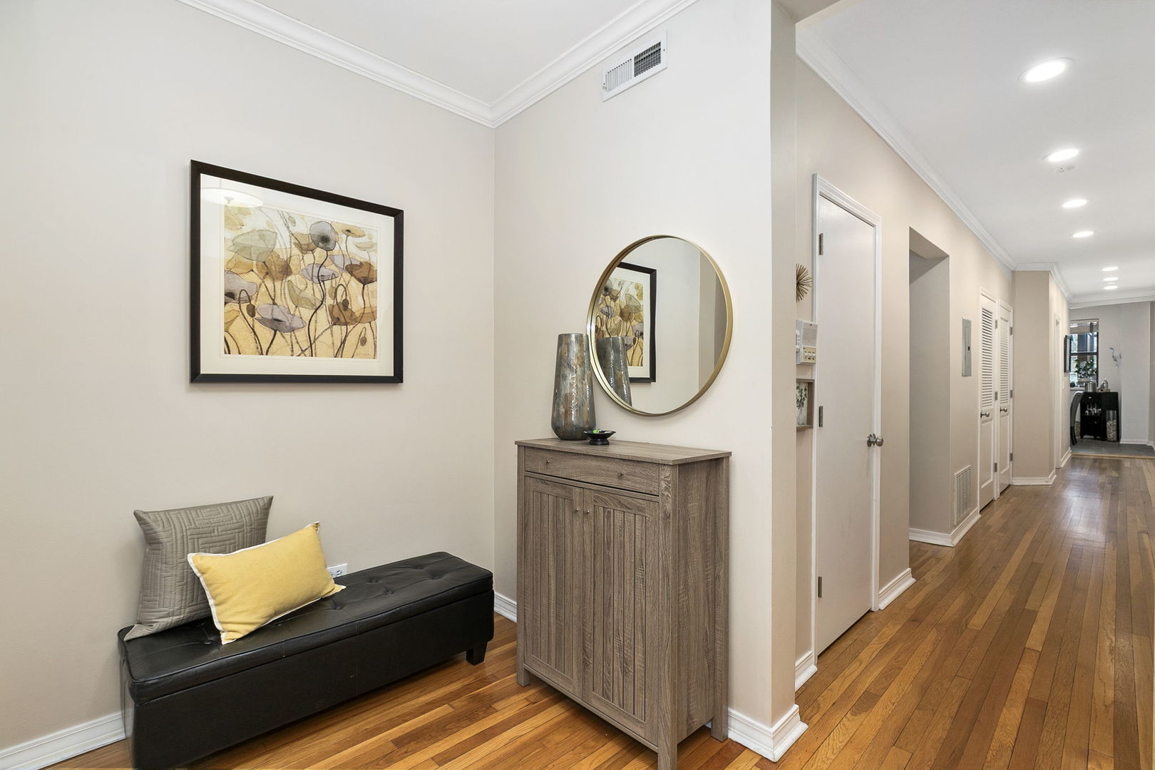 4429 North Beacon Street, Unit 2N Chicago, IL 60640 - Photo 3 of 32 a view of a hallway with wooden floor and furniture