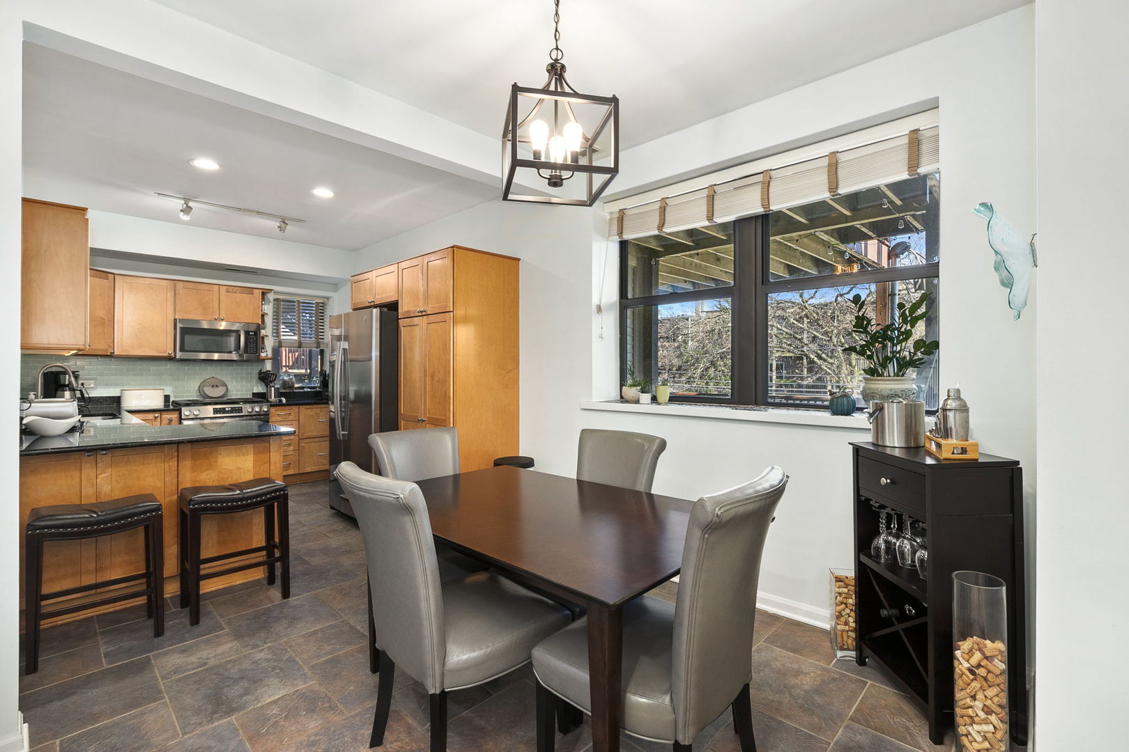 4429 North Beacon Street, Unit 2N Chicago, IL 60640 - Photo 9 of 32 a view of a dining room with furniture window and outside view