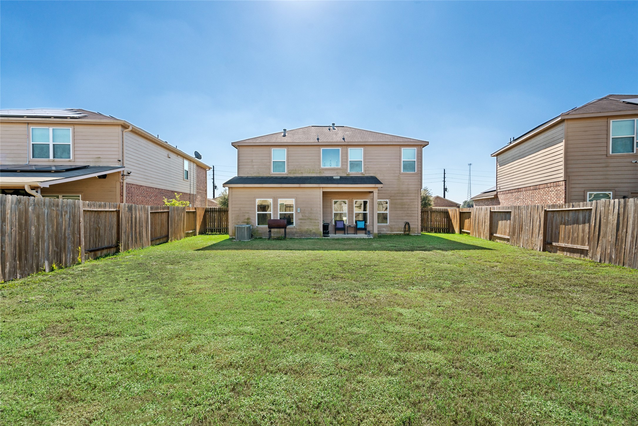 2011 Beach Bluff Road Rosenberg, TX 77469 - Photo 30 of 34 This spacious backyard is a private oasis, perfect for outdoor activities, entertaining, or simply relaxing. With lush greenery and plenty of open space, it’s ideal for family gatherings, playtime, and enjoying nature.