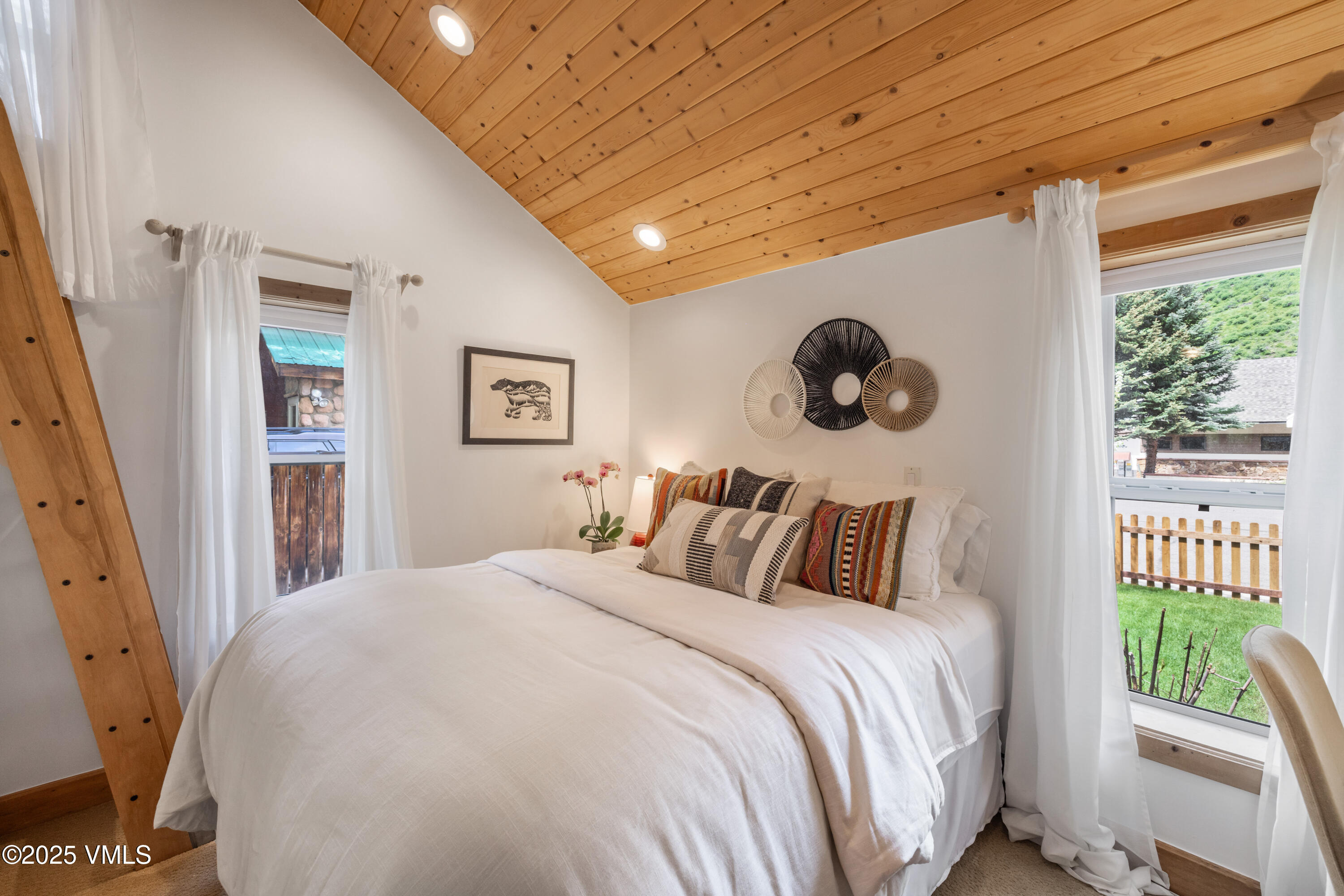 473 Pine Street Minturn, CO 81645 - Photo 11 of 26 a bedroom with a bed and a window