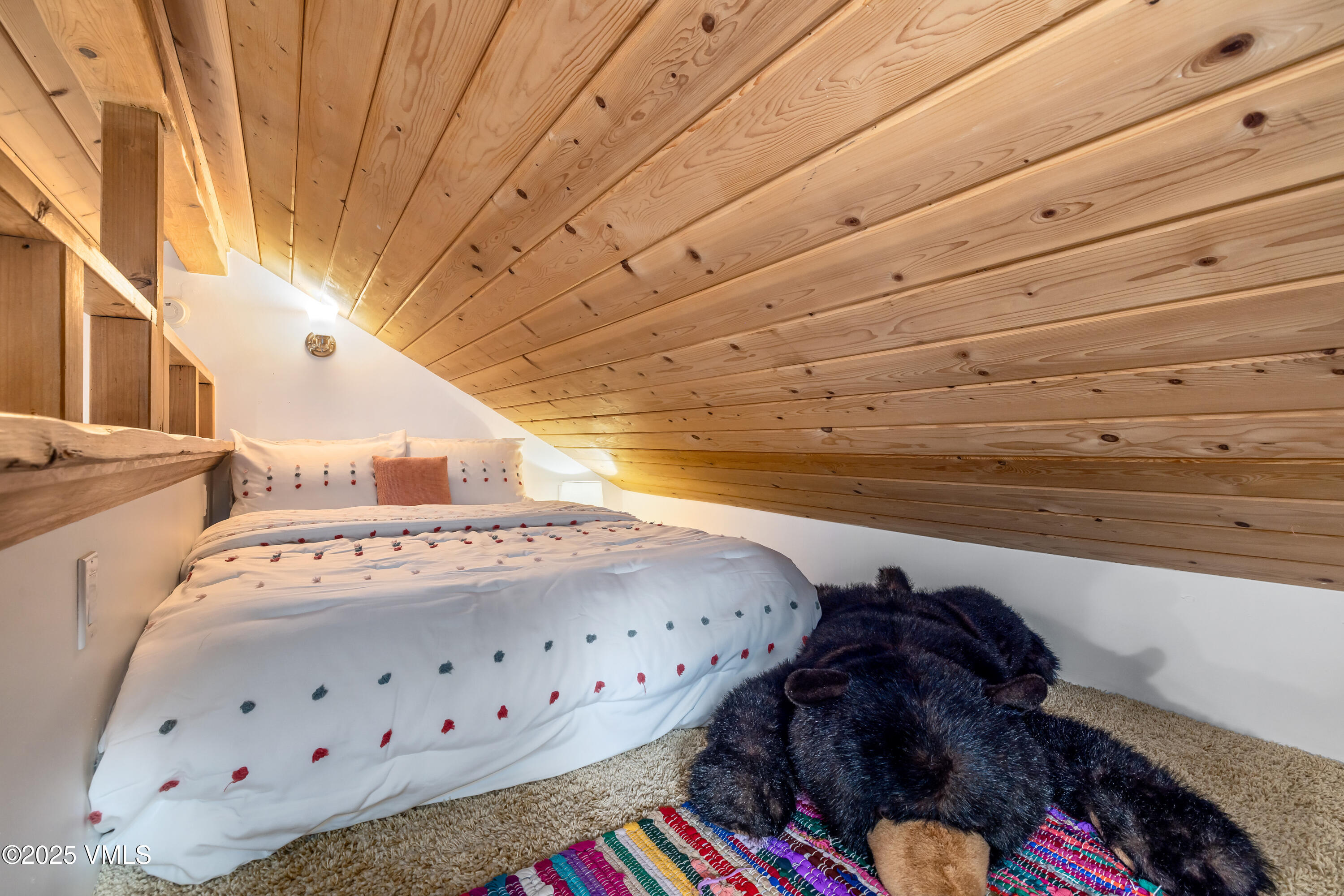 473 Pine Street Minturn, CO 81645 - Photo 13 of 26 a bed with white sheets and pillows on it