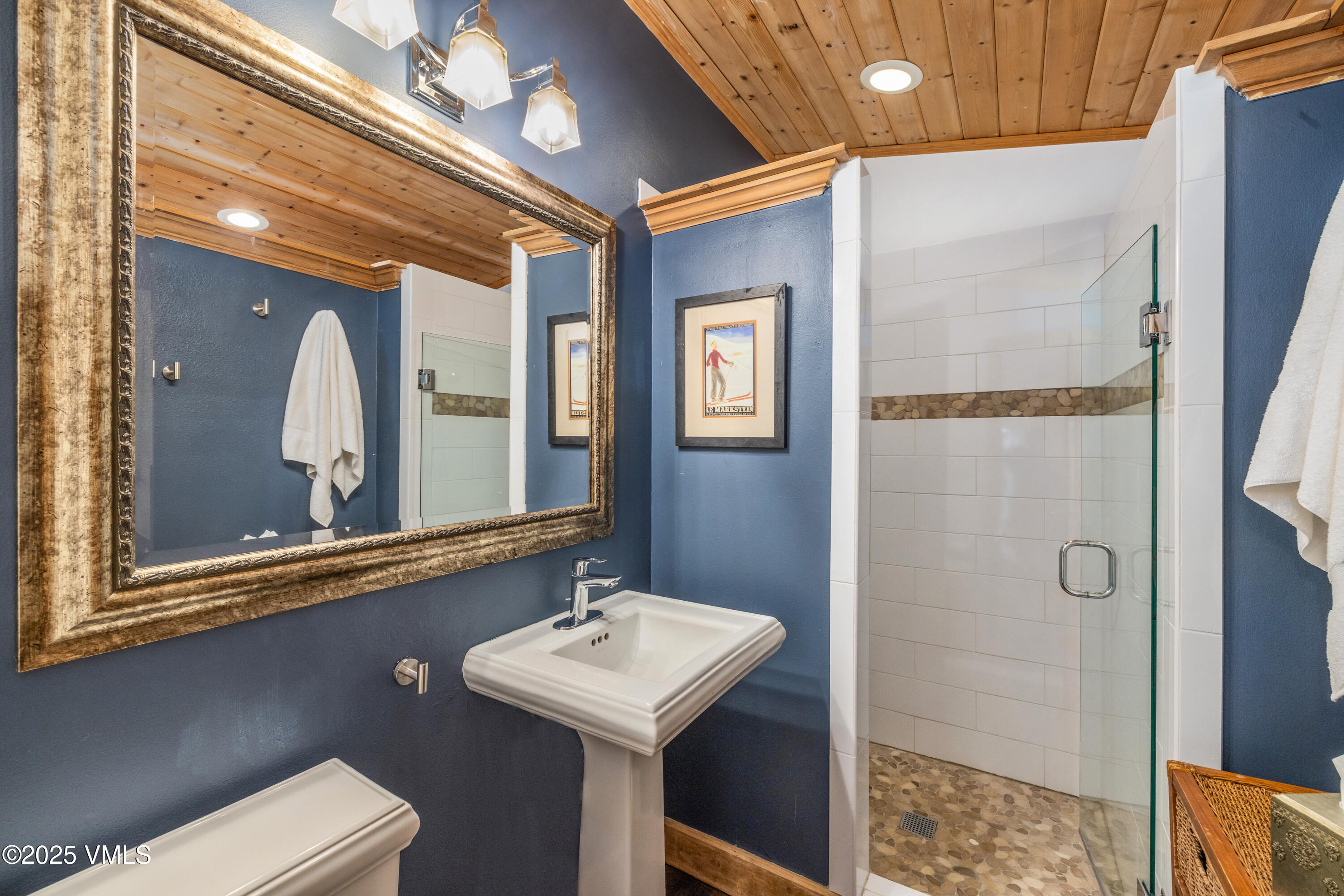 473 Pine Street Minturn, CO 81645 - Photo 14 of 26 a bathroom with a sink a mirror a vanity and shower