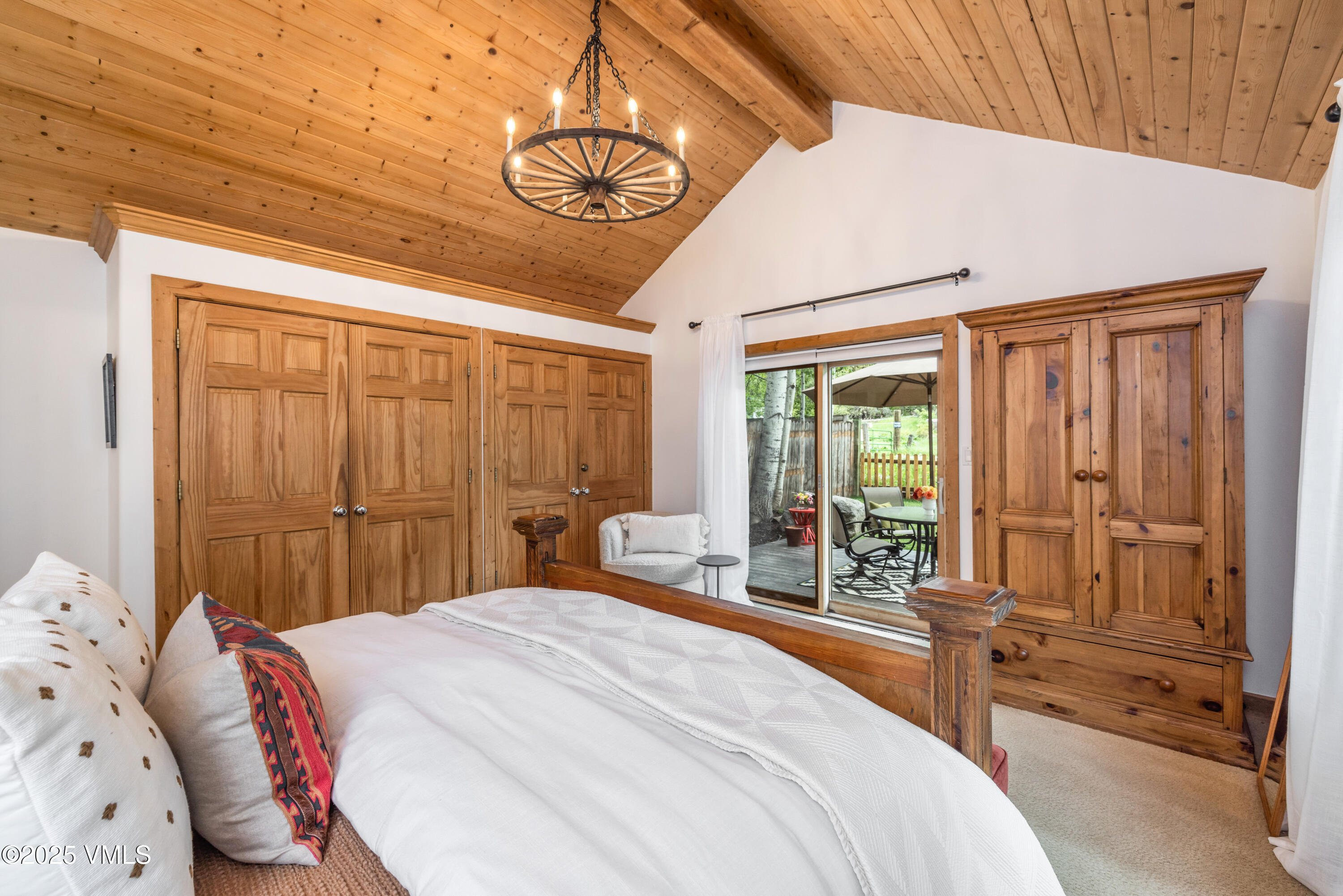 473 Pine Street Minturn, CO 81645 - Photo 16 of 26 a bedroom with a large bed and a large window