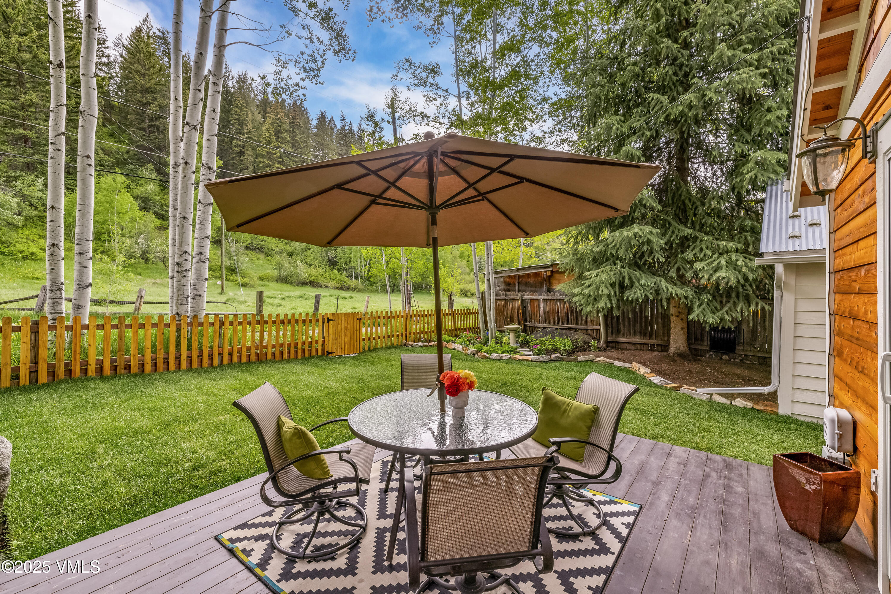 473 Pine Street Minturn, CO 81645 - Photo 17 of 26 a view of a table and chairs in backyard of the house