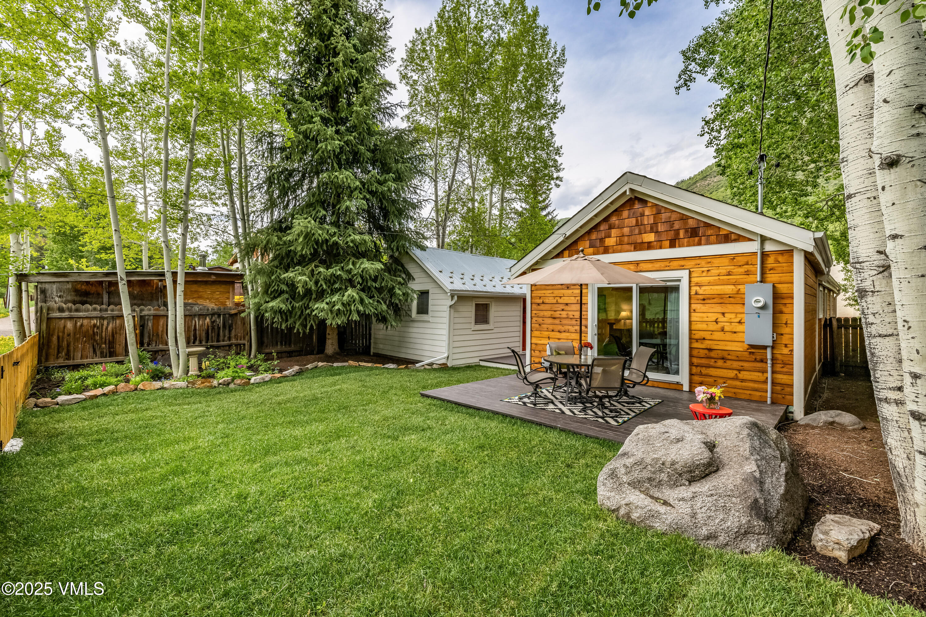 473 Pine Street Minturn, CO 81645 - Photo 18 of 26 a front view of a house with a yard table and chairs