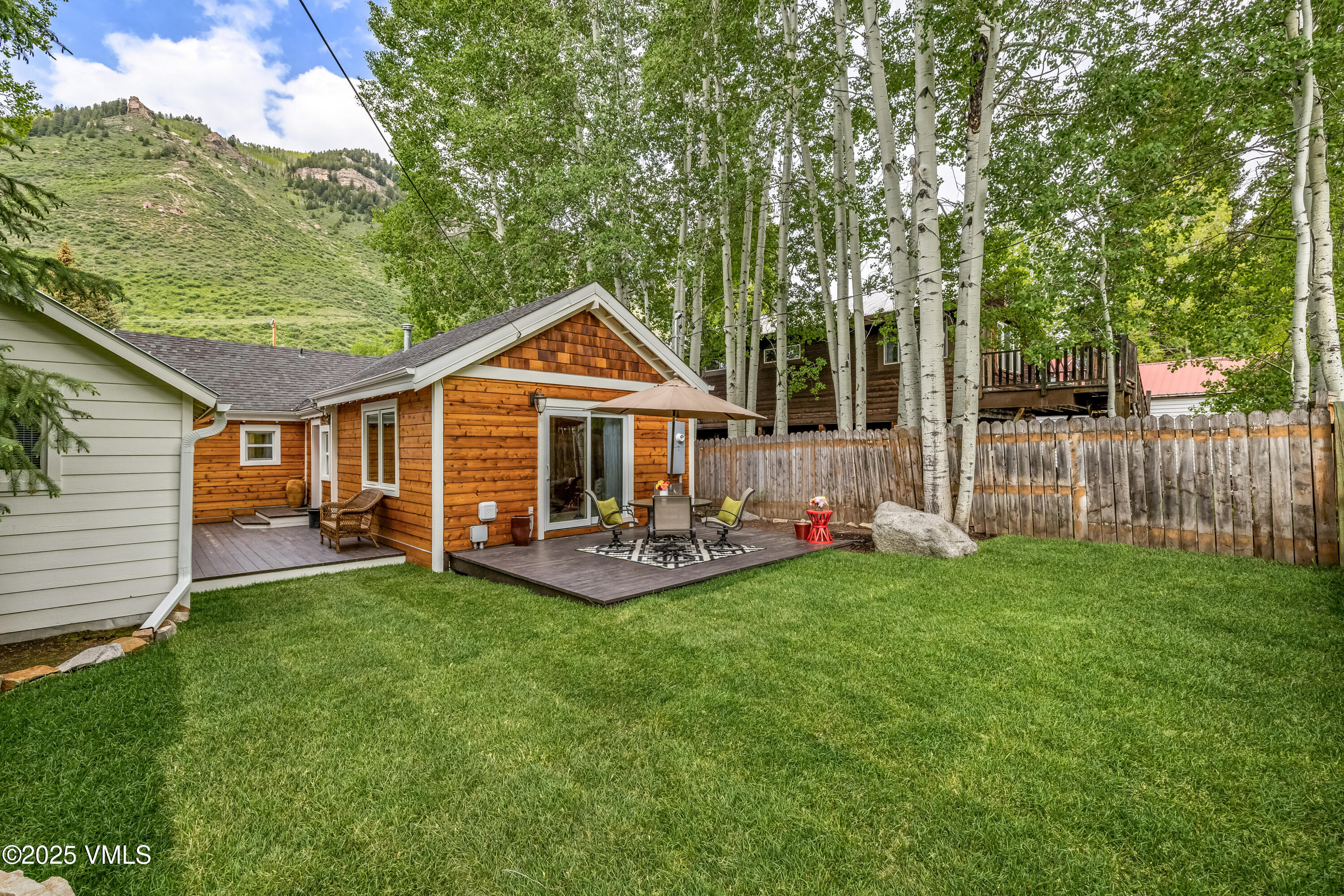 473 Pine Street Minturn, CO 81645 - Photo 19 of 26 a front view of a house with a yard and porch