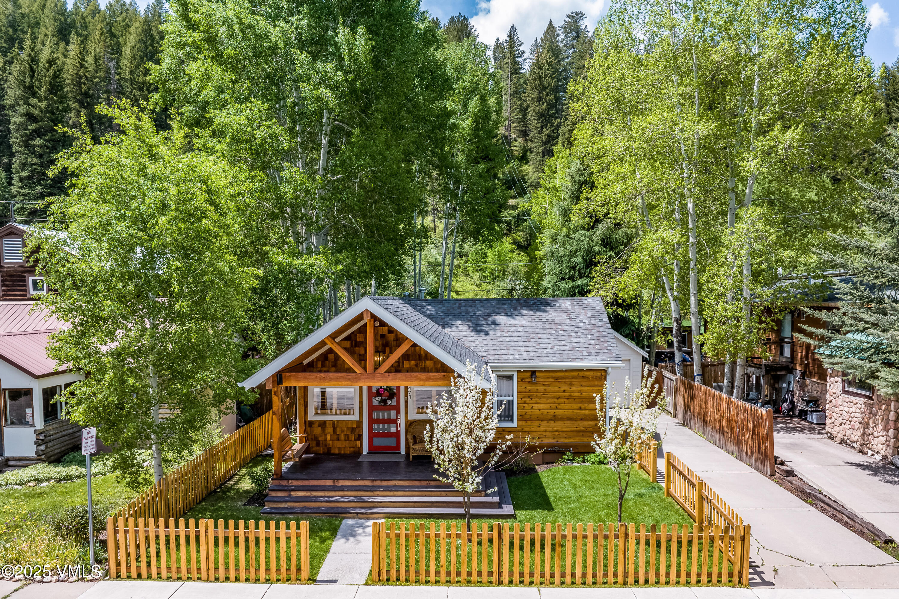 473 Pine Street Minturn, CO 81645 - Photo 26 of 26 a view of a house with a small yard plants and large trees