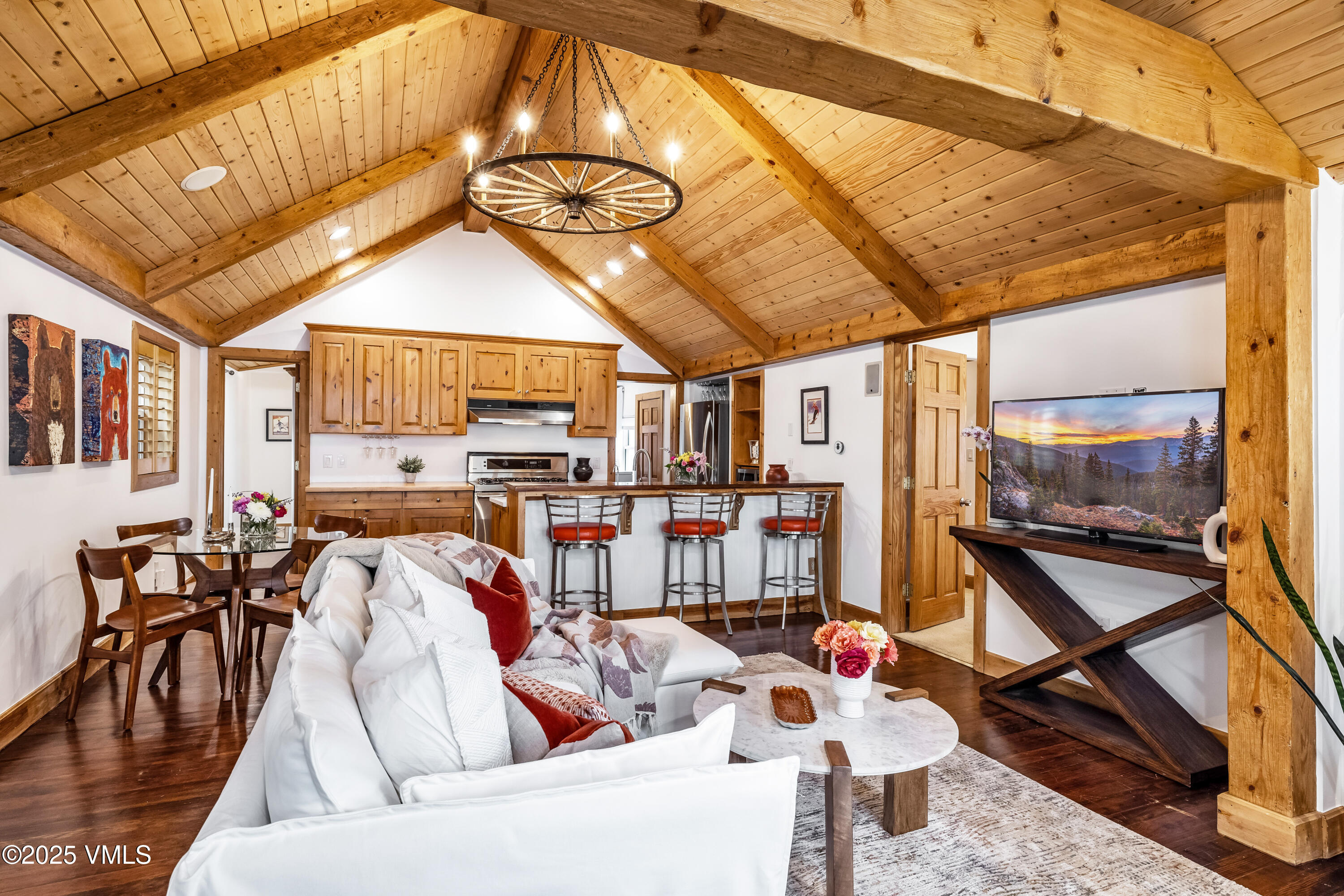 473 Pine Street Minturn, CO 81645 - Photo 6 of 26 a living room with lots of furniture and a chandelier