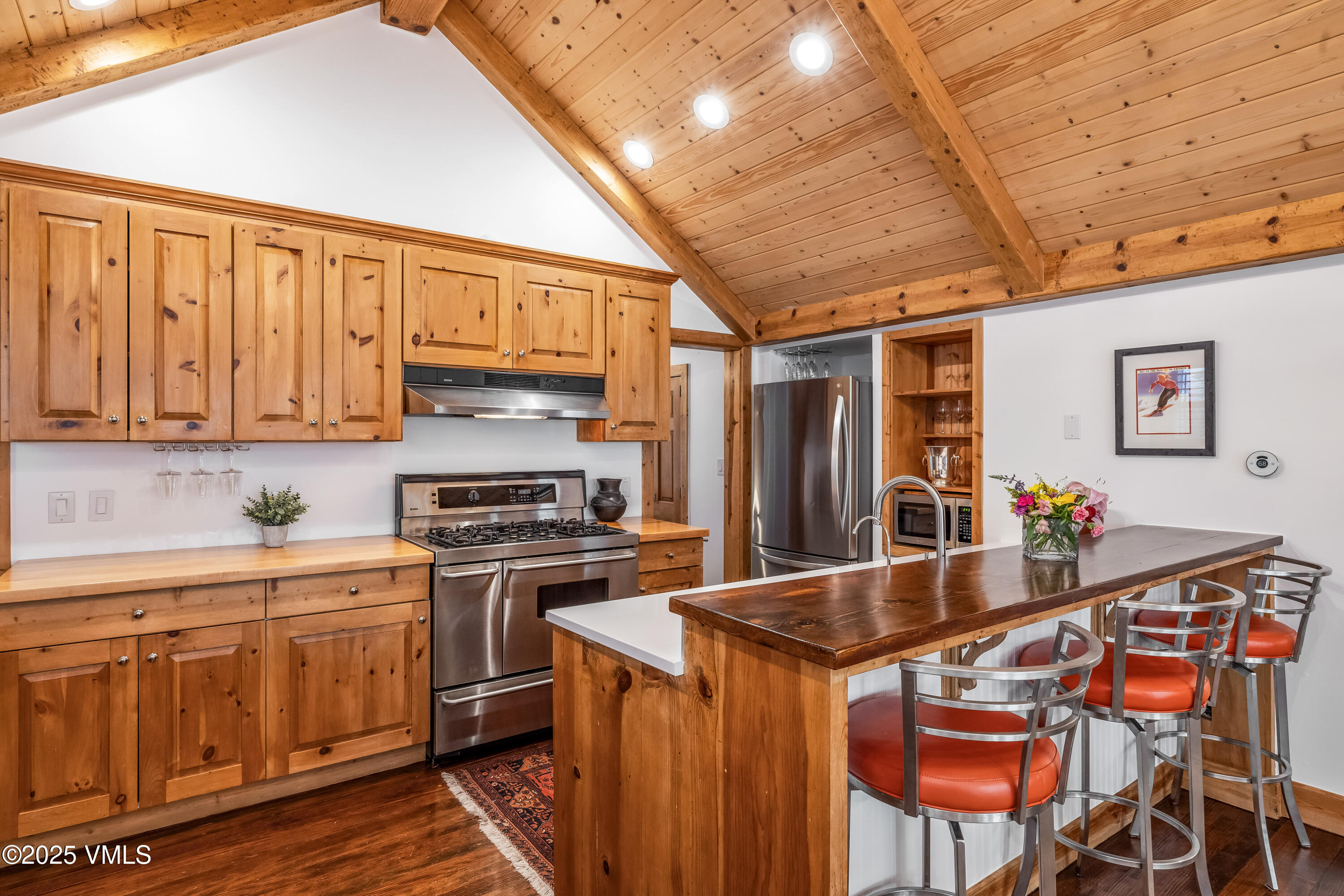473 Pine Street Minturn, CO 81645 - Photo 7 of 26 a kitchen with stainless steel appliances granite countertop a stove refrigerator sink and cabinets