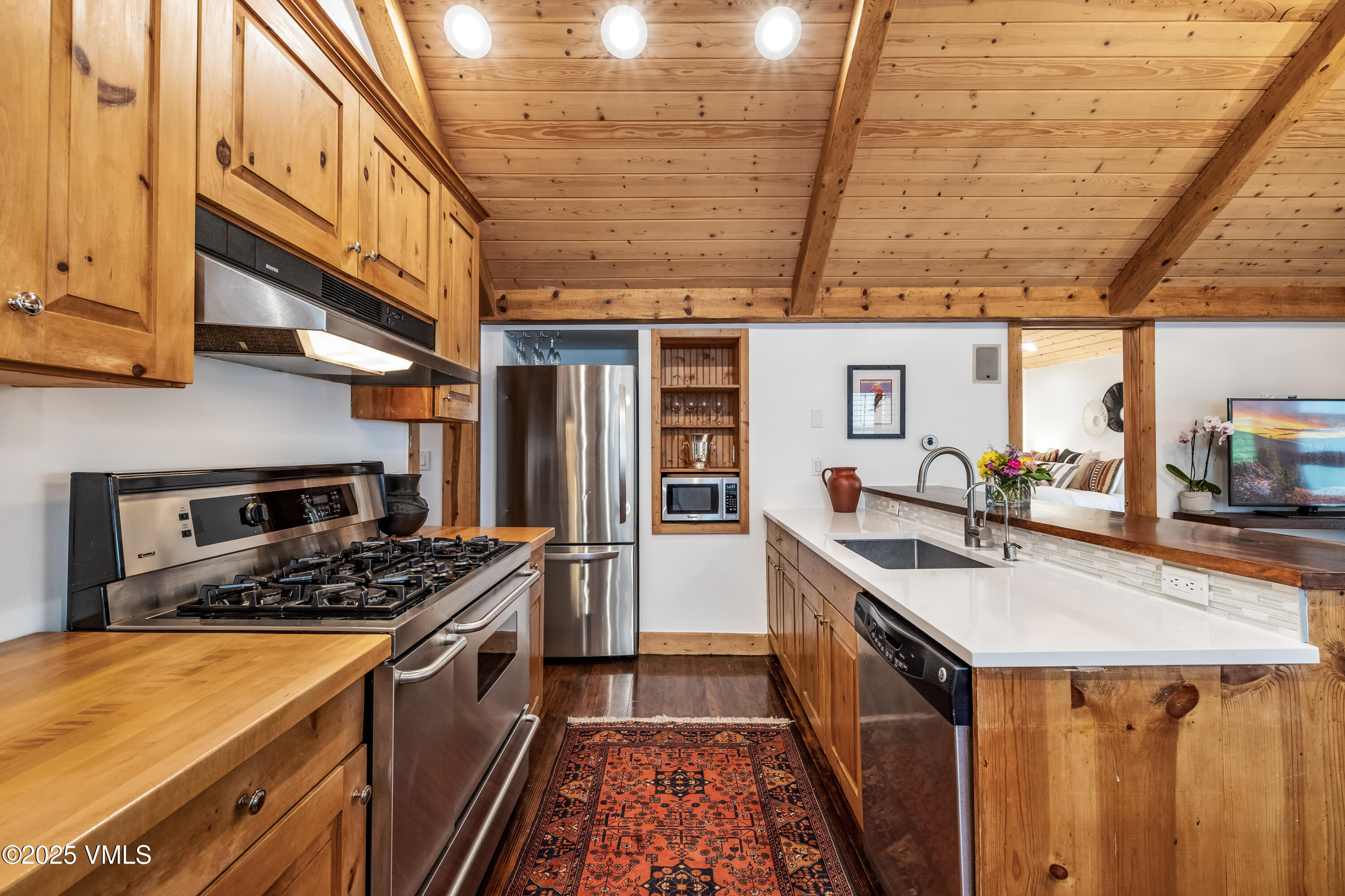 473 Pine Street Minturn, CO 81645 - Photo 8 of 26 a kitchen with stainless steel appliances granite countertop a stove and a sink