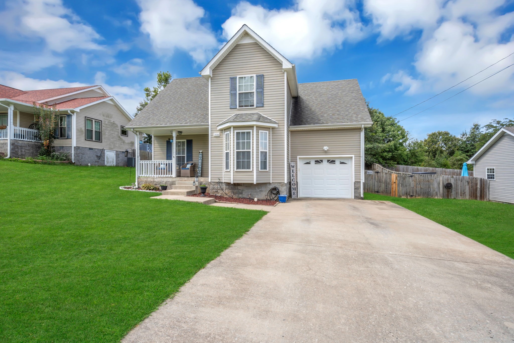 2838 Rome Lane Clarksville, TN 37040 - Photo 3 of 50 a front view of a house with a yard and garage