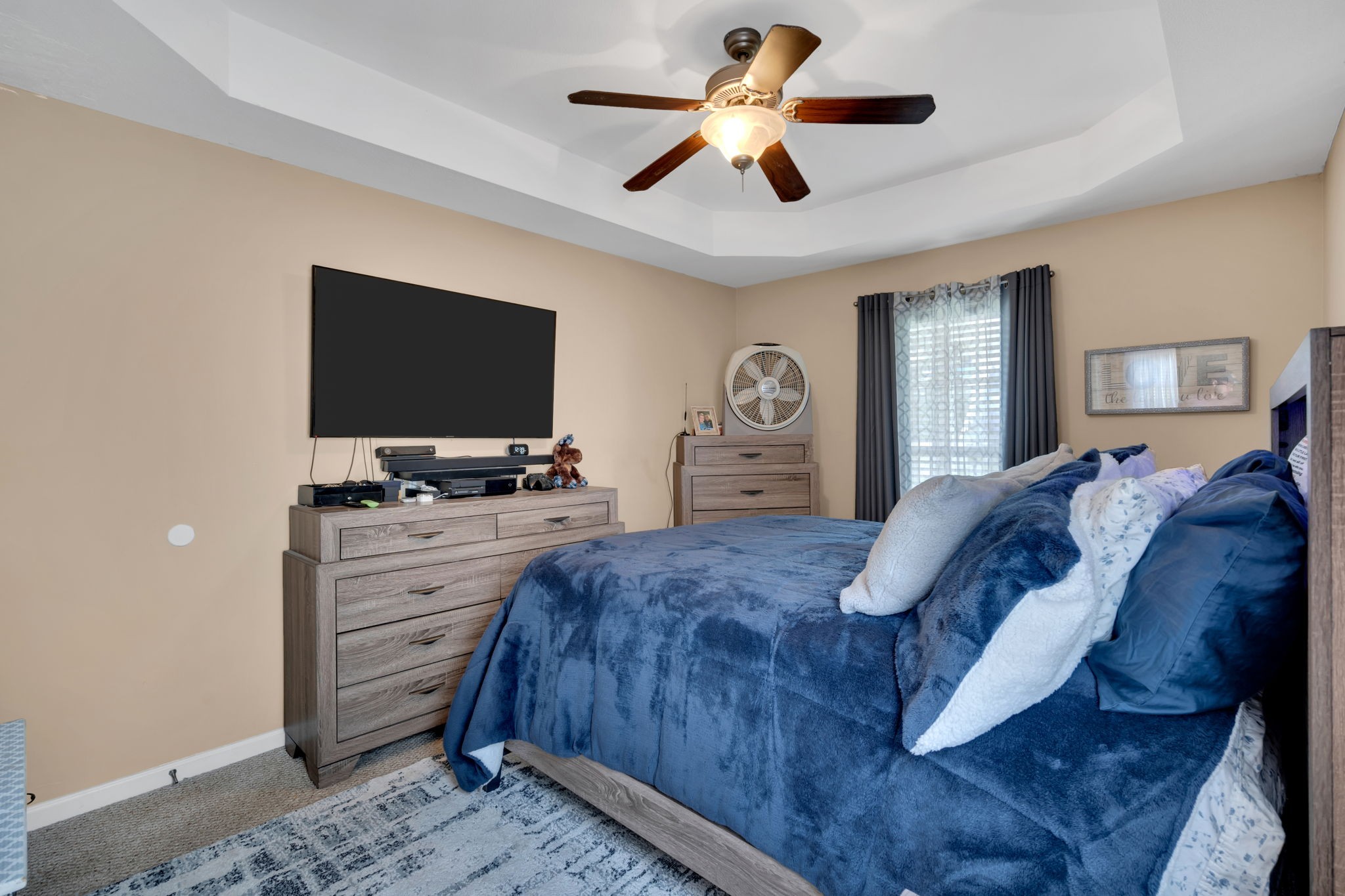 2838 Rome Lane Clarksville, TN 37040 - Photo 31 of 50 a spacious bedroom with a bed and a flat screen tv
