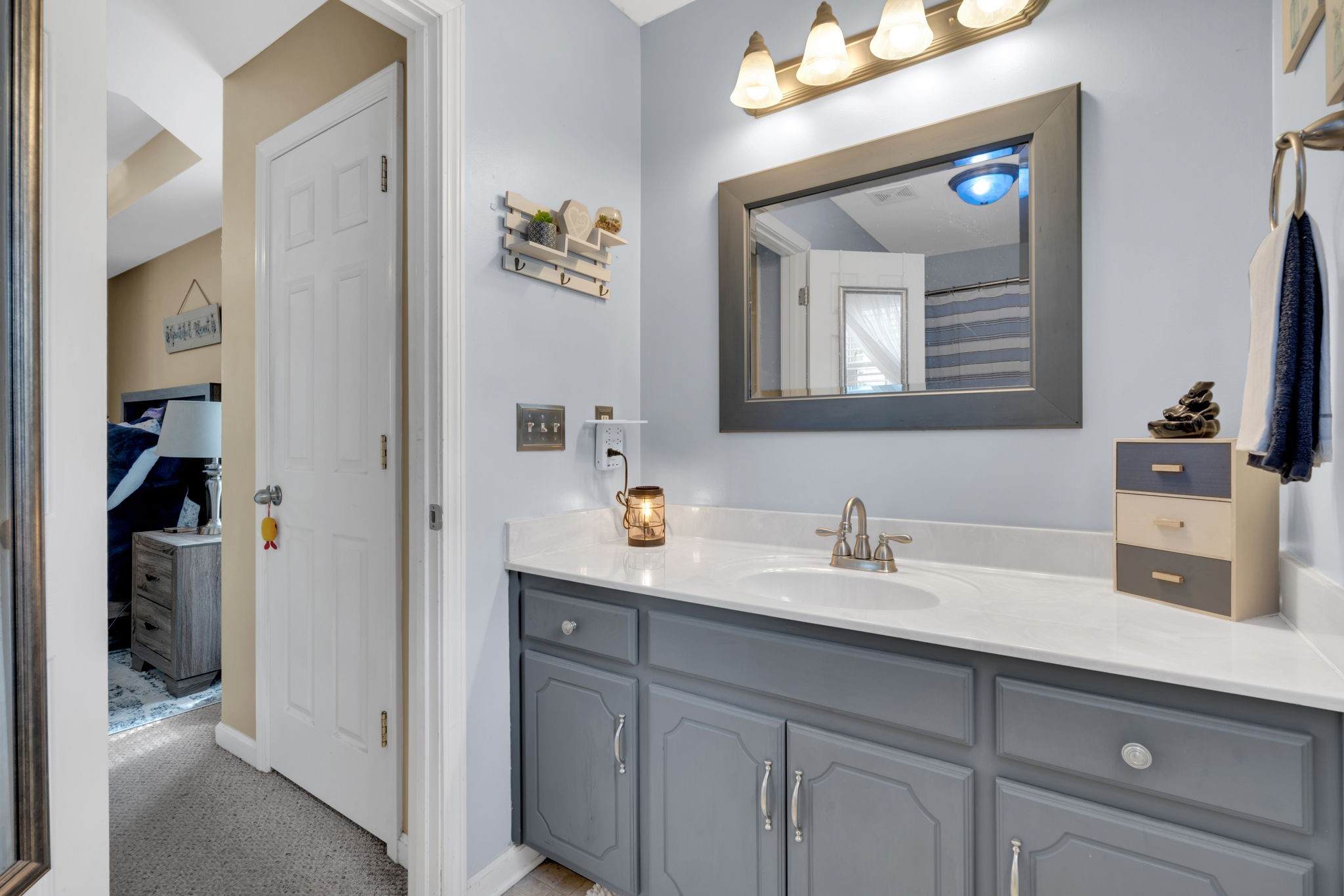 2838 Rome Lane Clarksville, TN 37040 - Photo 32 of 50 a bathroom with a sink and two mirror