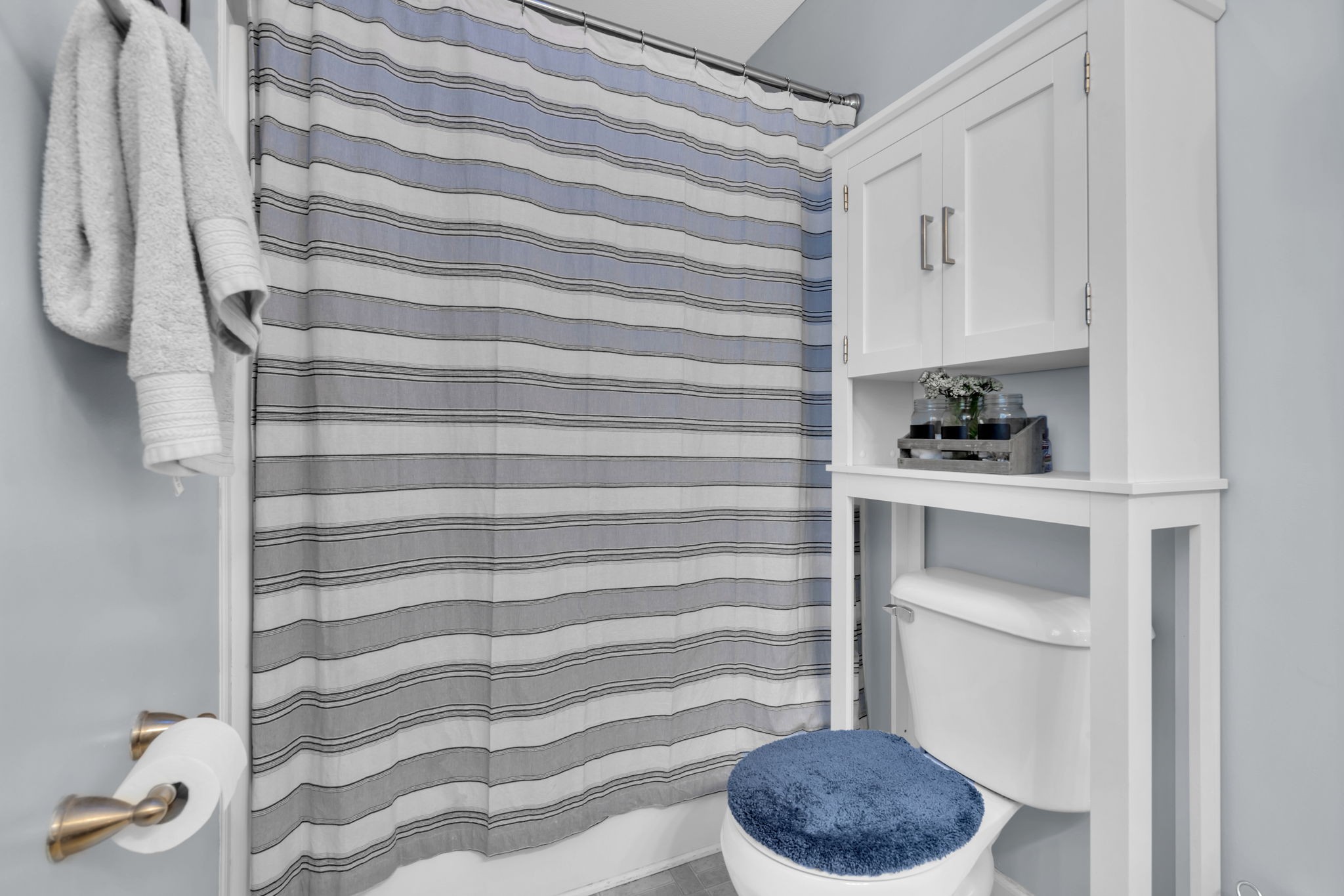 2838 Rome Lane Clarksville, TN 37040 - Photo 34 of 50 a bathroom with a toilet and a shower curtain