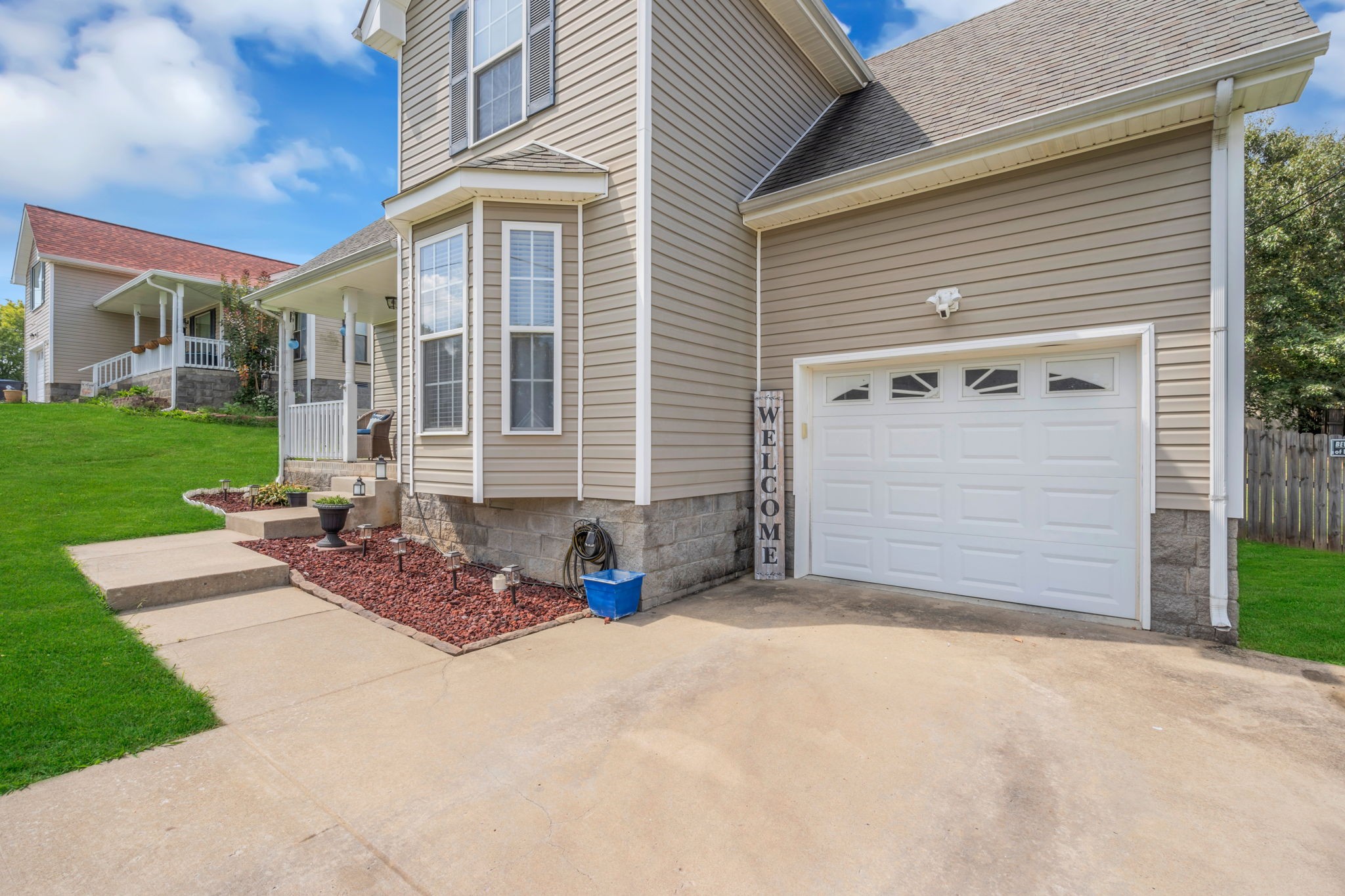 2838 Rome Lane Clarksville, TN 37040 - Photo 6 of 50 a front view of a house with a yard and garage